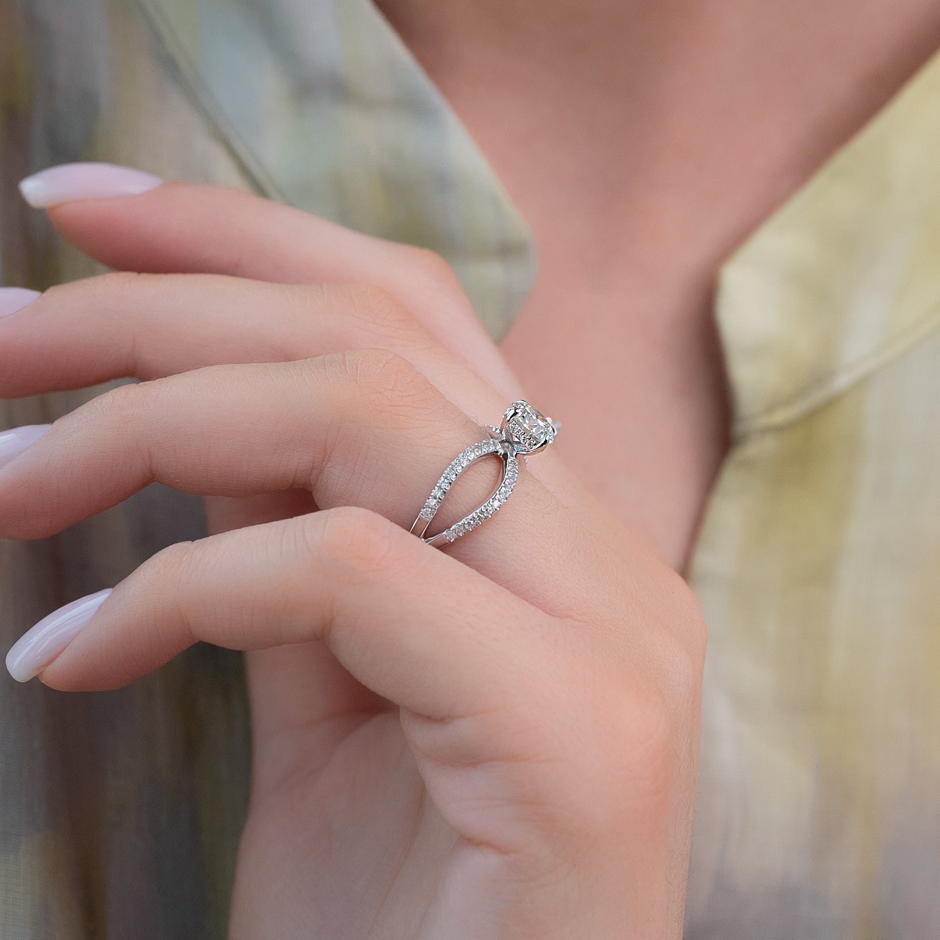 Round cut CVD diamond criss-cross engagement ring in white gold setting