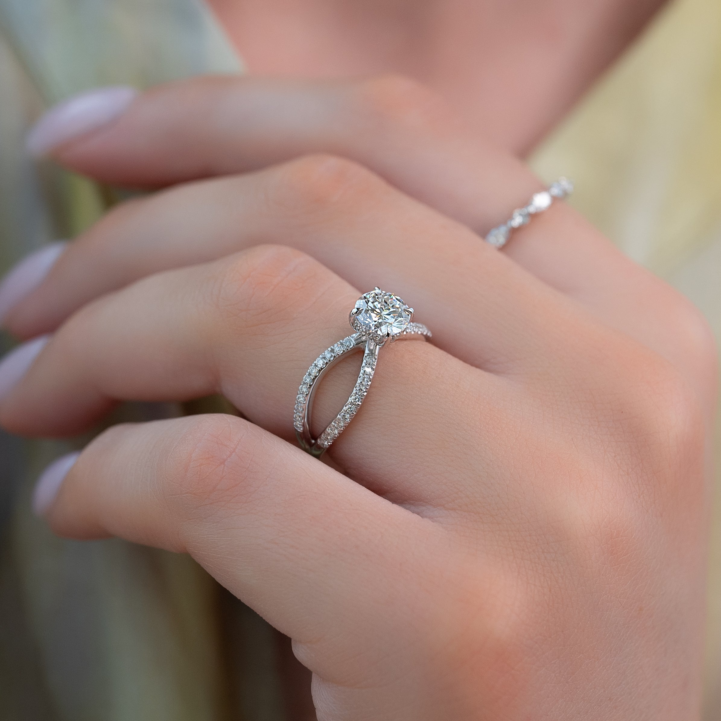 Round cut CVD diamond criss-cross engagement ring in white gold setting