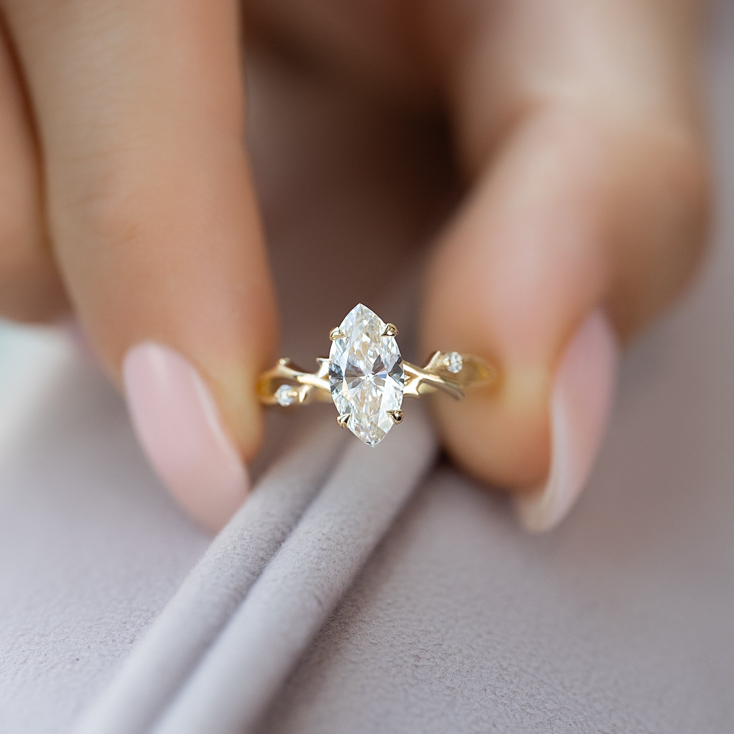 Marquise cut CVD diamond engagement ring with twig-style band in white gold