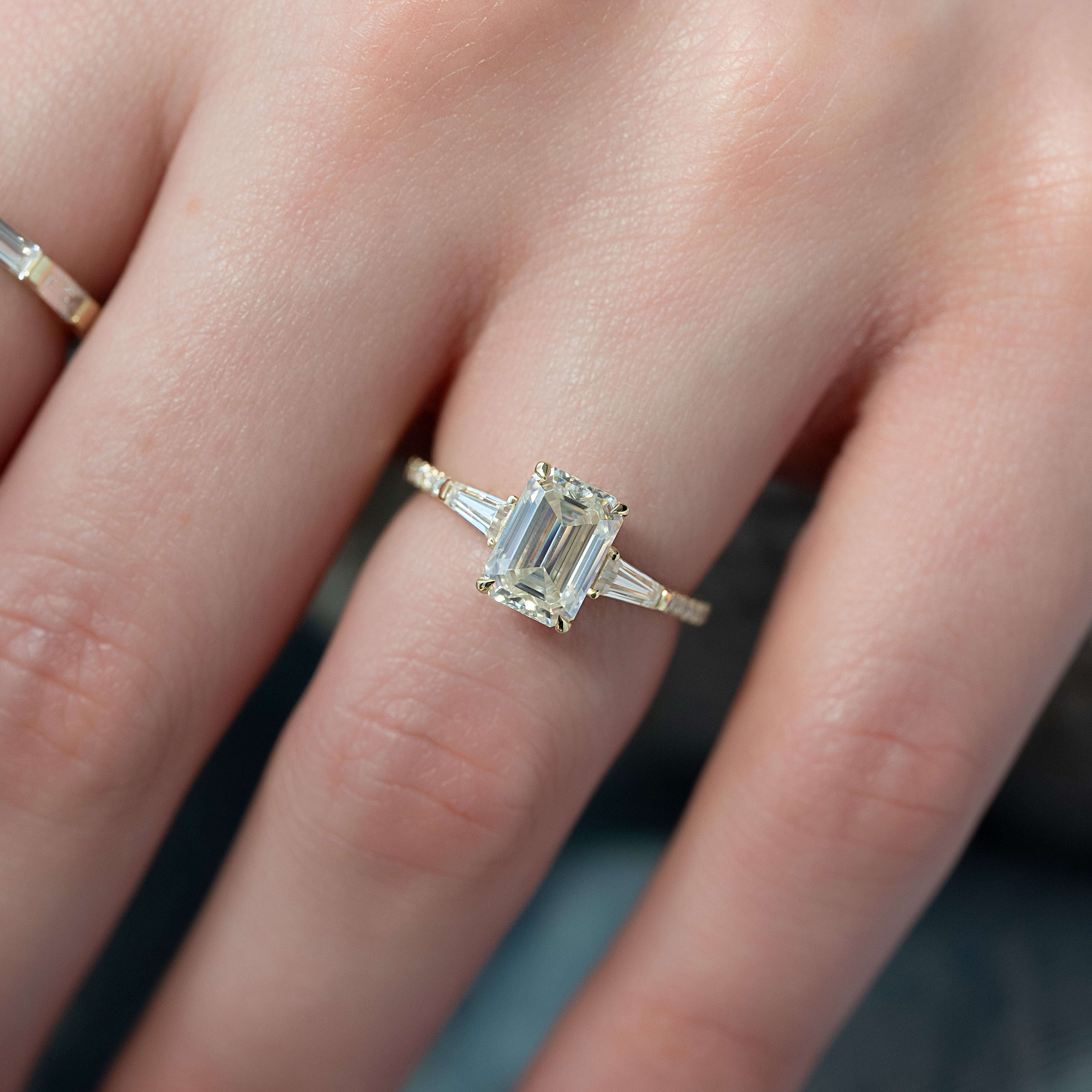 Emerald cut CVD diamond engagement ring with pave band in white gold