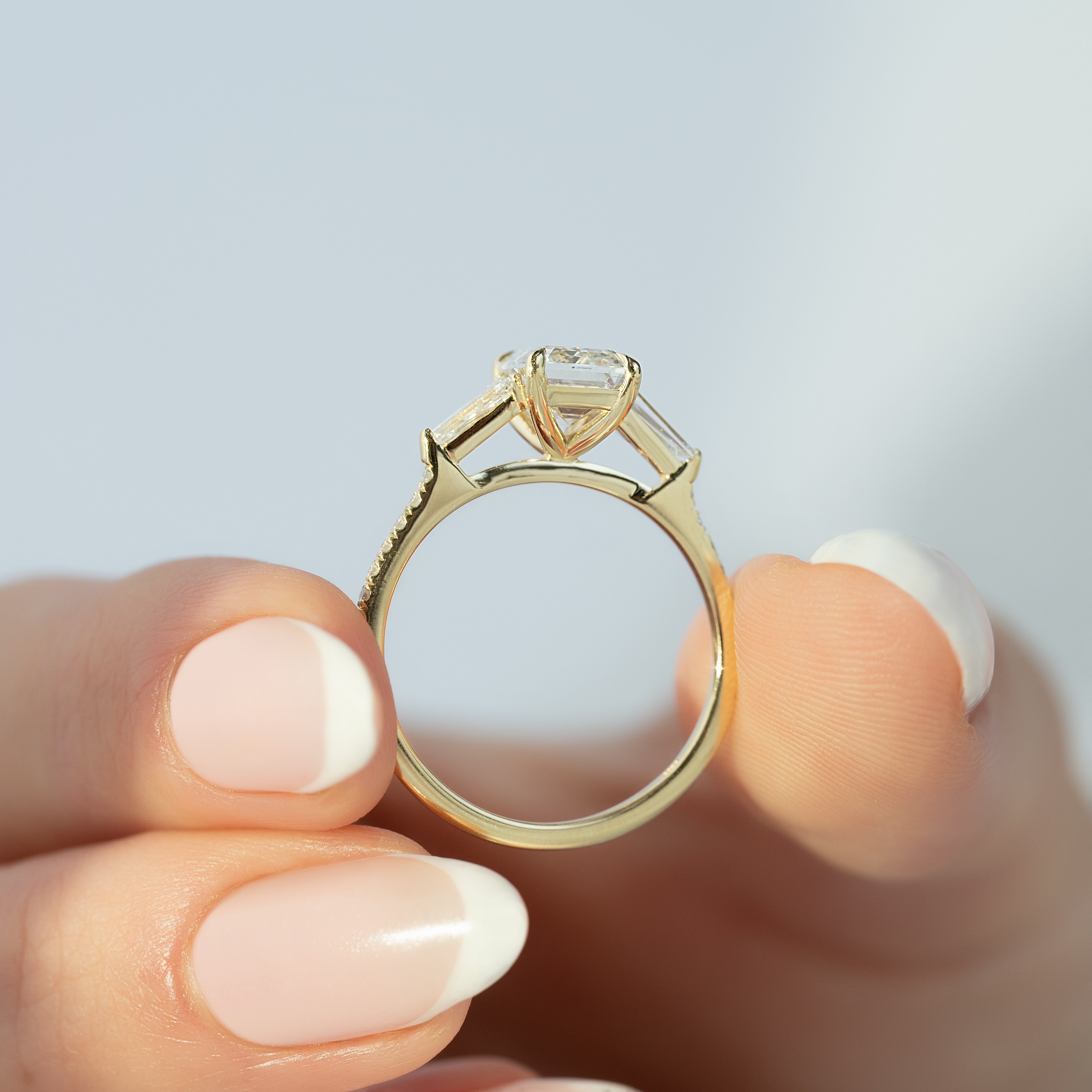 Emerald cut CVD diamond engagement ring with pave band in white gold