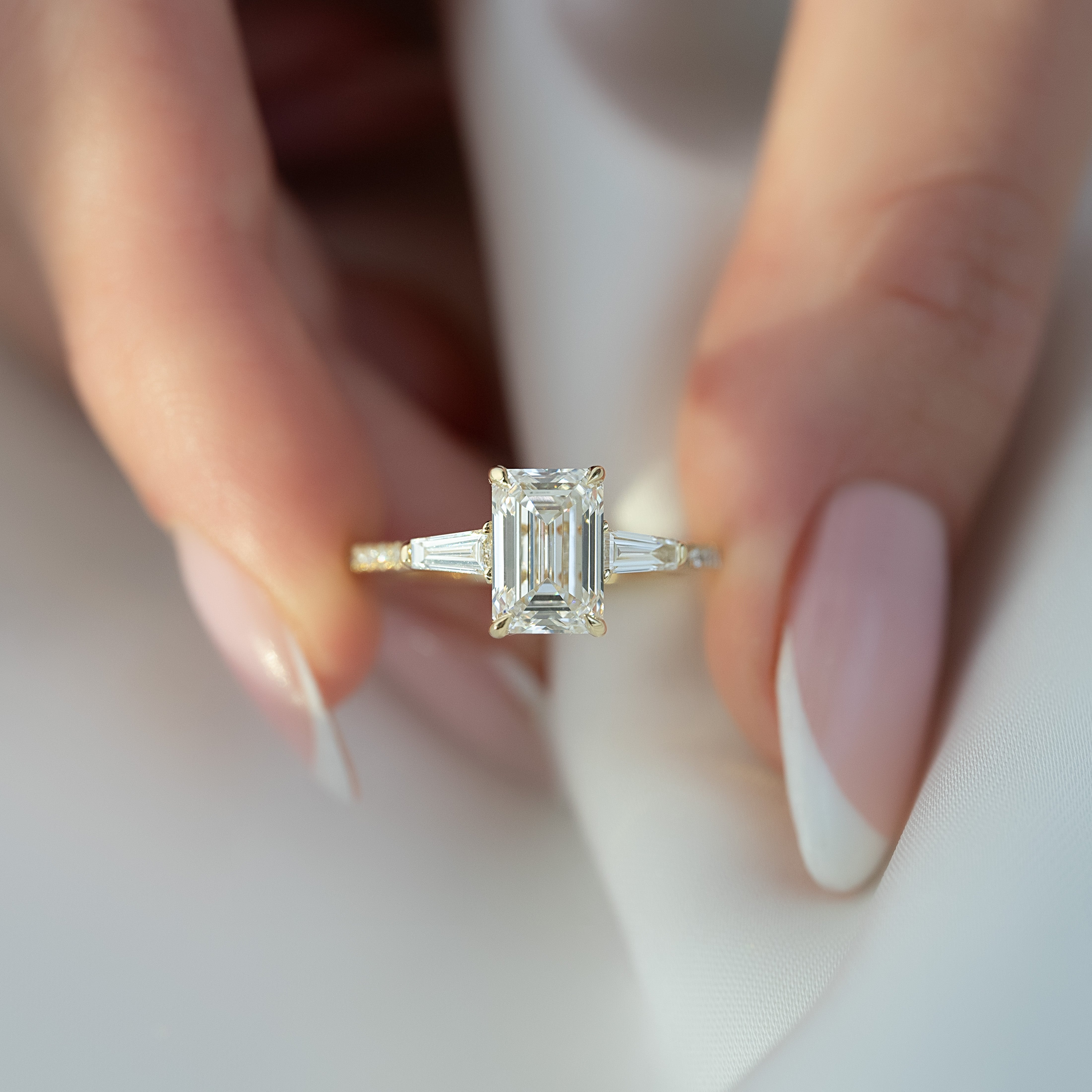 Emerald cut CVD diamond engagement ring with pave band in white gold