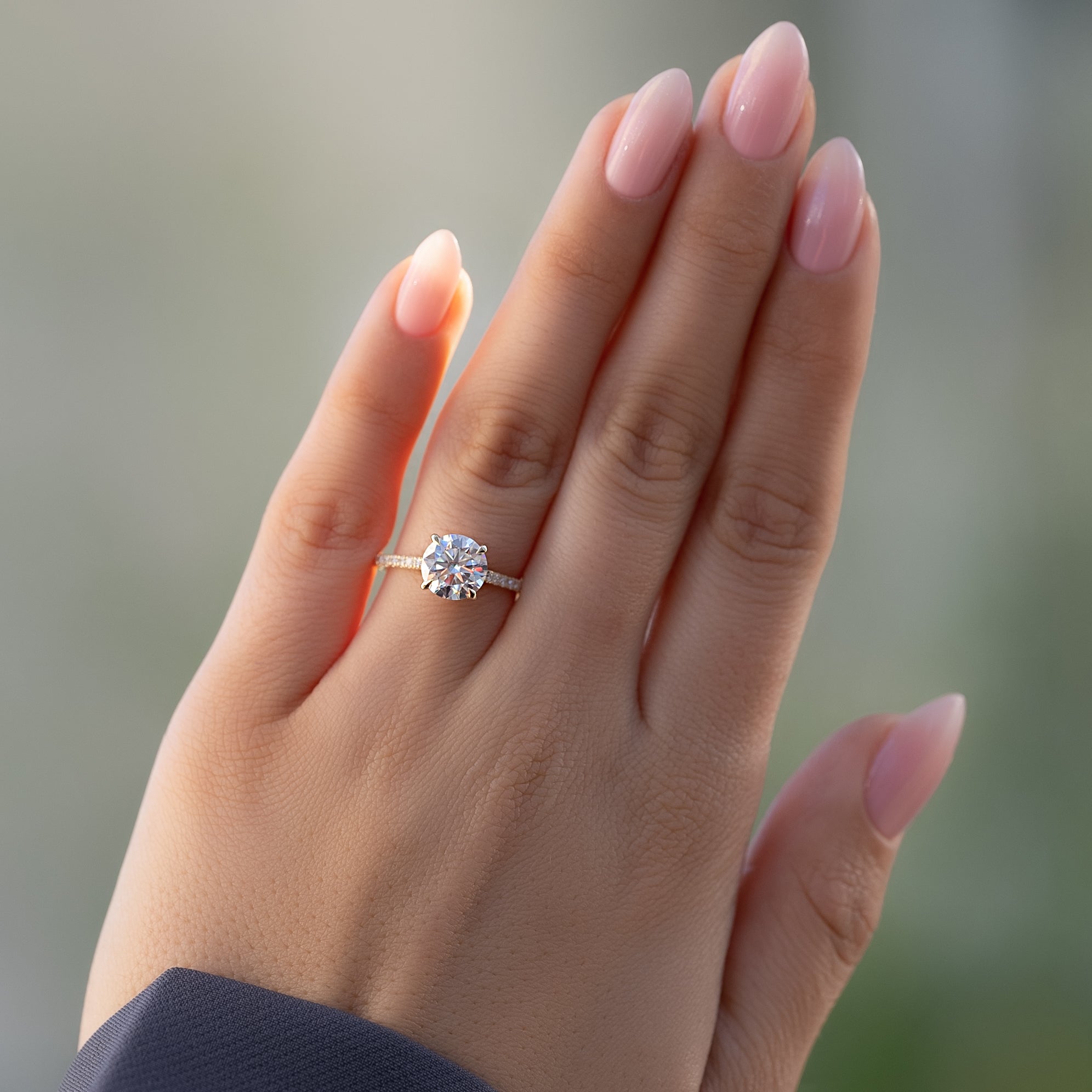 Round cut CVD diamond hidden halo engagement ring with pave diamond band in platinum setting