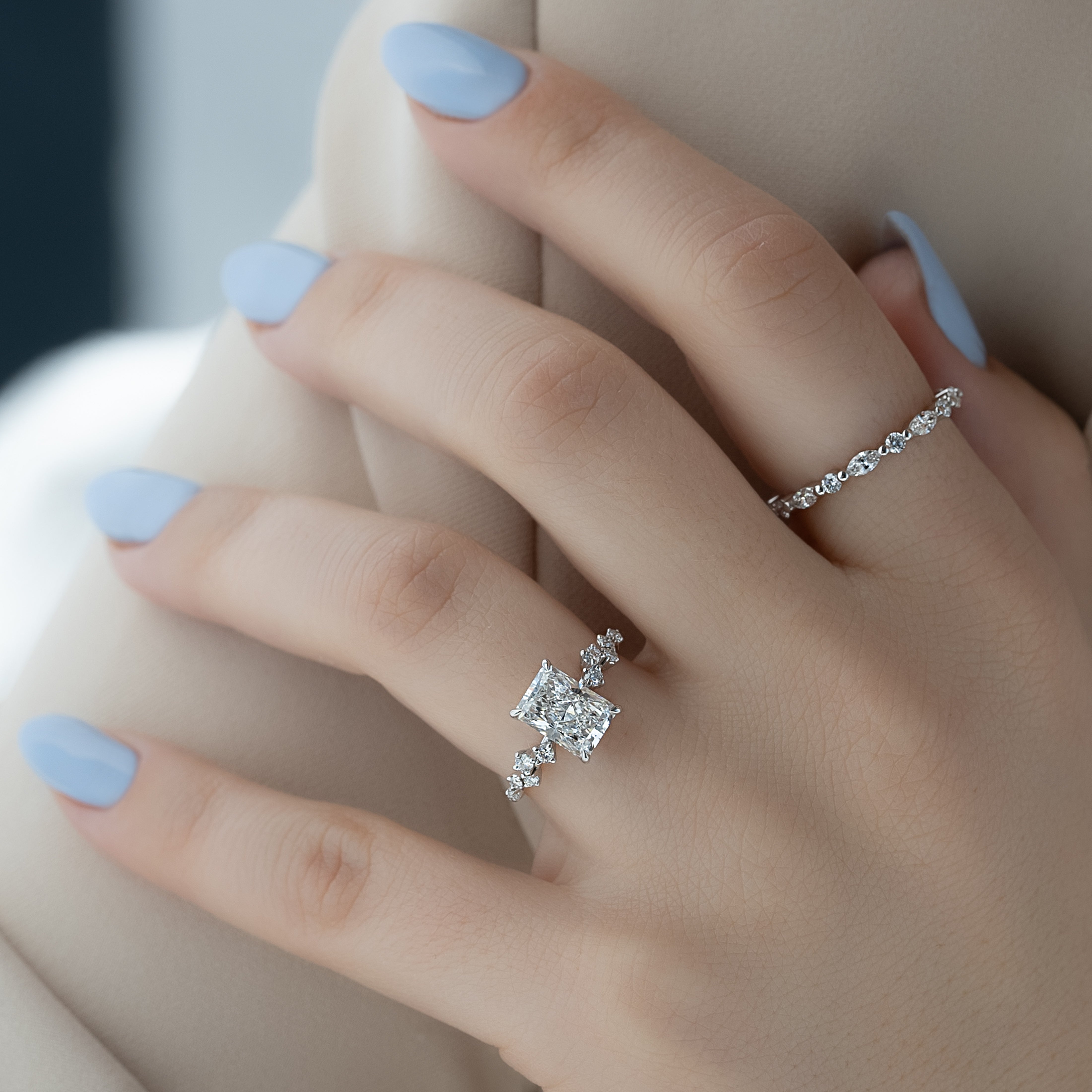 Radiant cut CVD diamond engagement ring with hidden halo and clustered diamond detailing in white gold