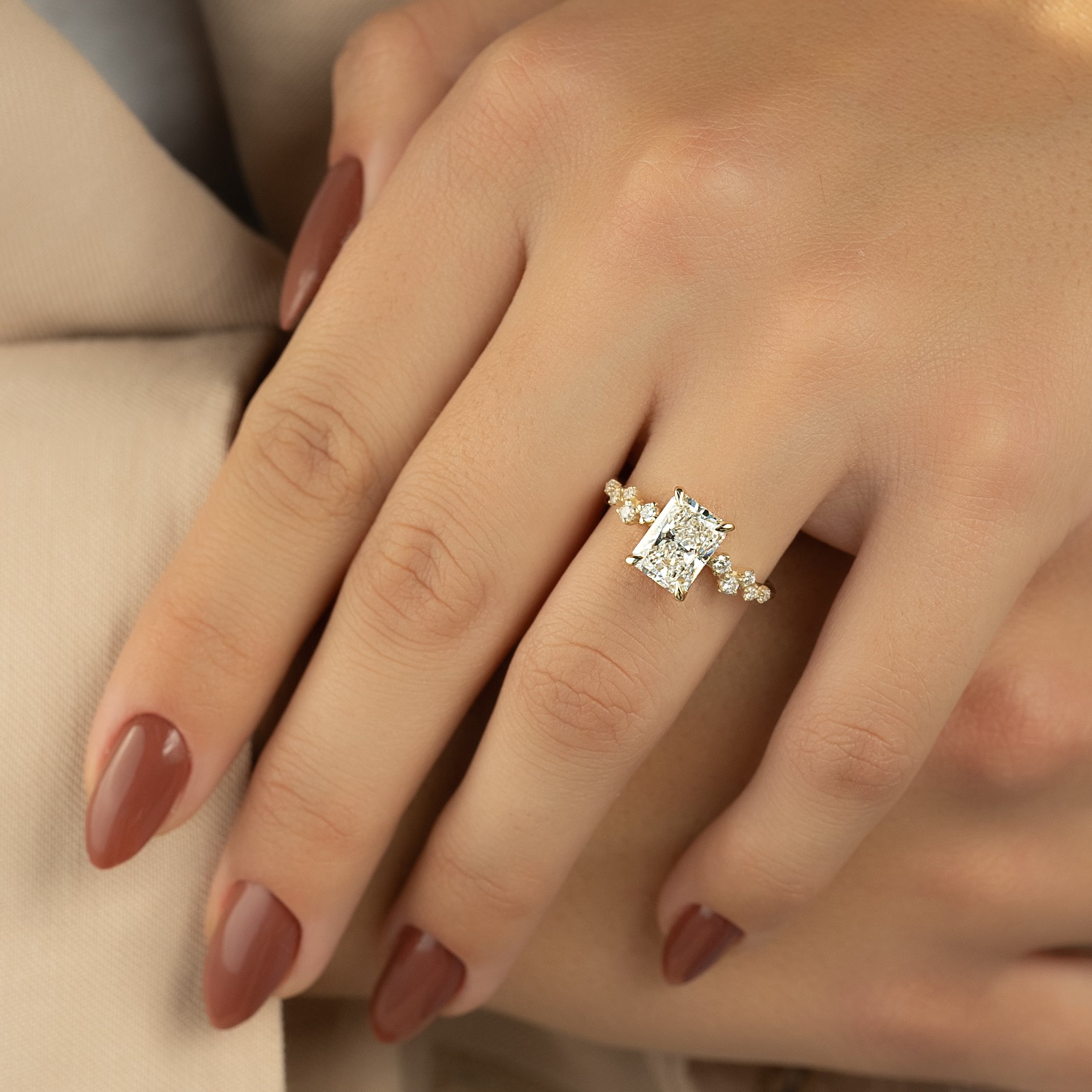 Radiant cut CVD diamond engagement ring with hidden halo and clustered diamond detailing in white gold
