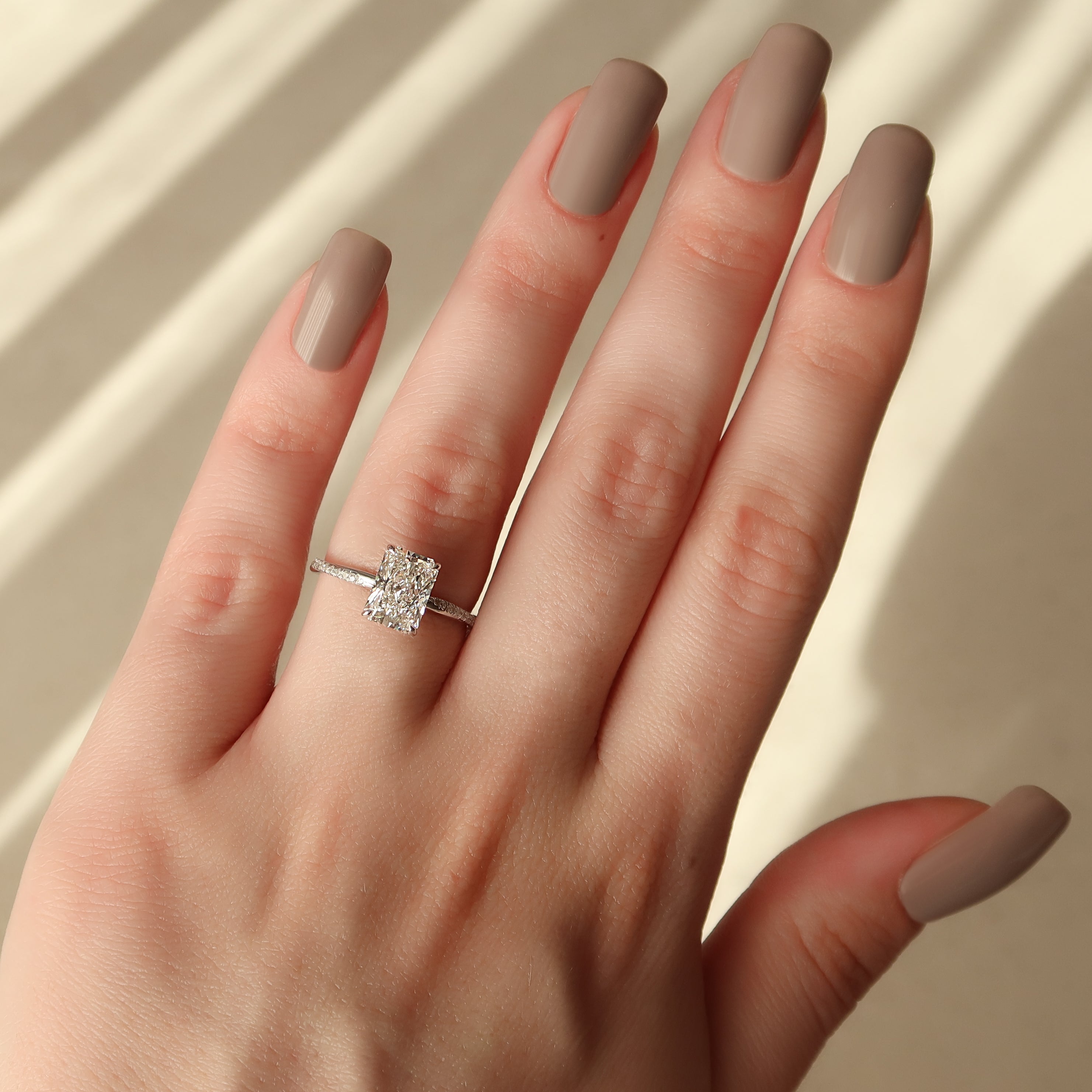 Radiant cut CVD diamond twisted pave engagement ring in white gold setting