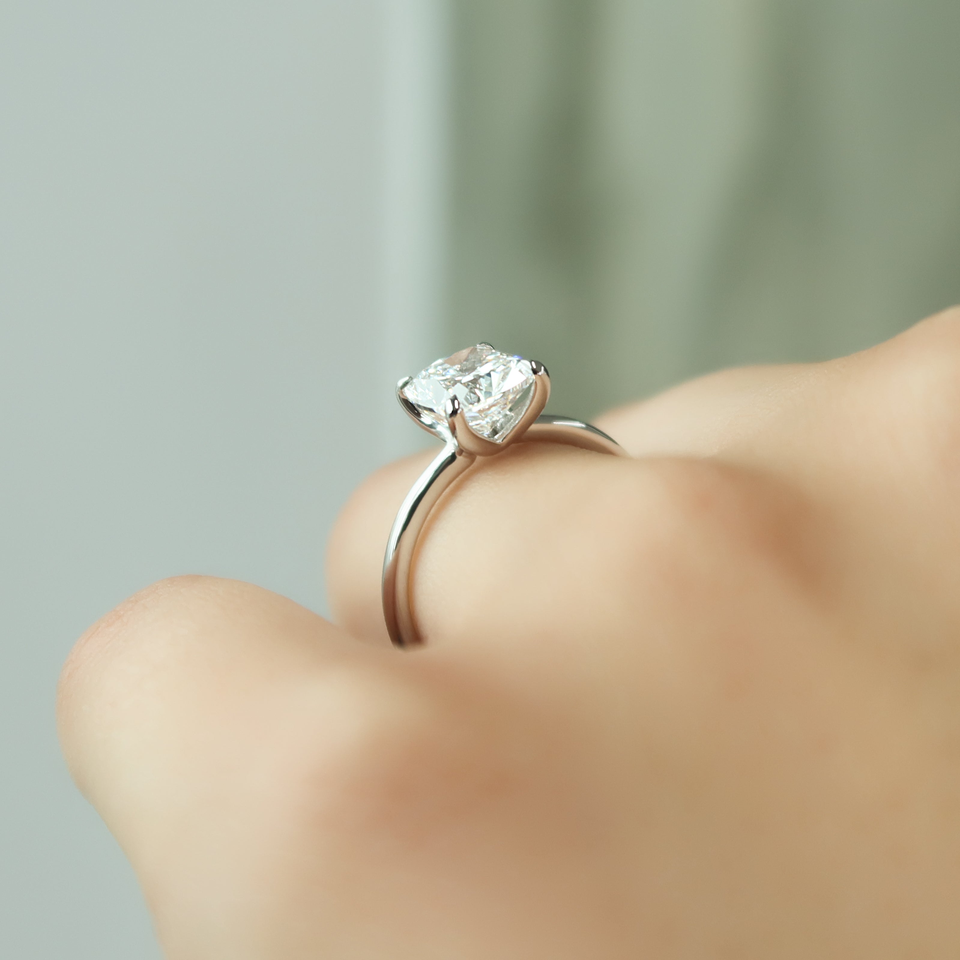 Elongated cushion cut CVD diamond solitaire engagement ring in white gold setting