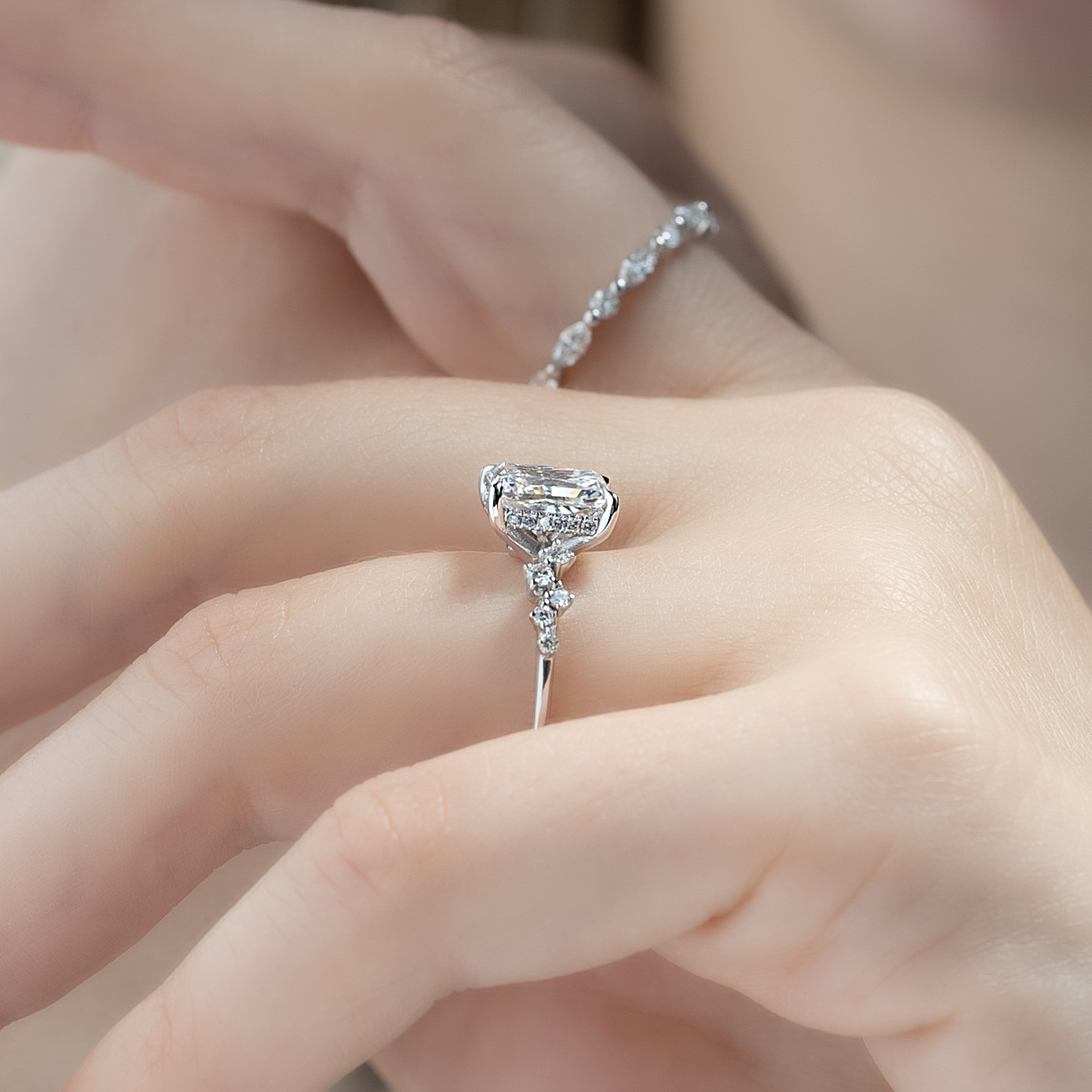 Radiant cut CVD diamond engagement ring with hidden halo and clustered diamond detailing in white gold