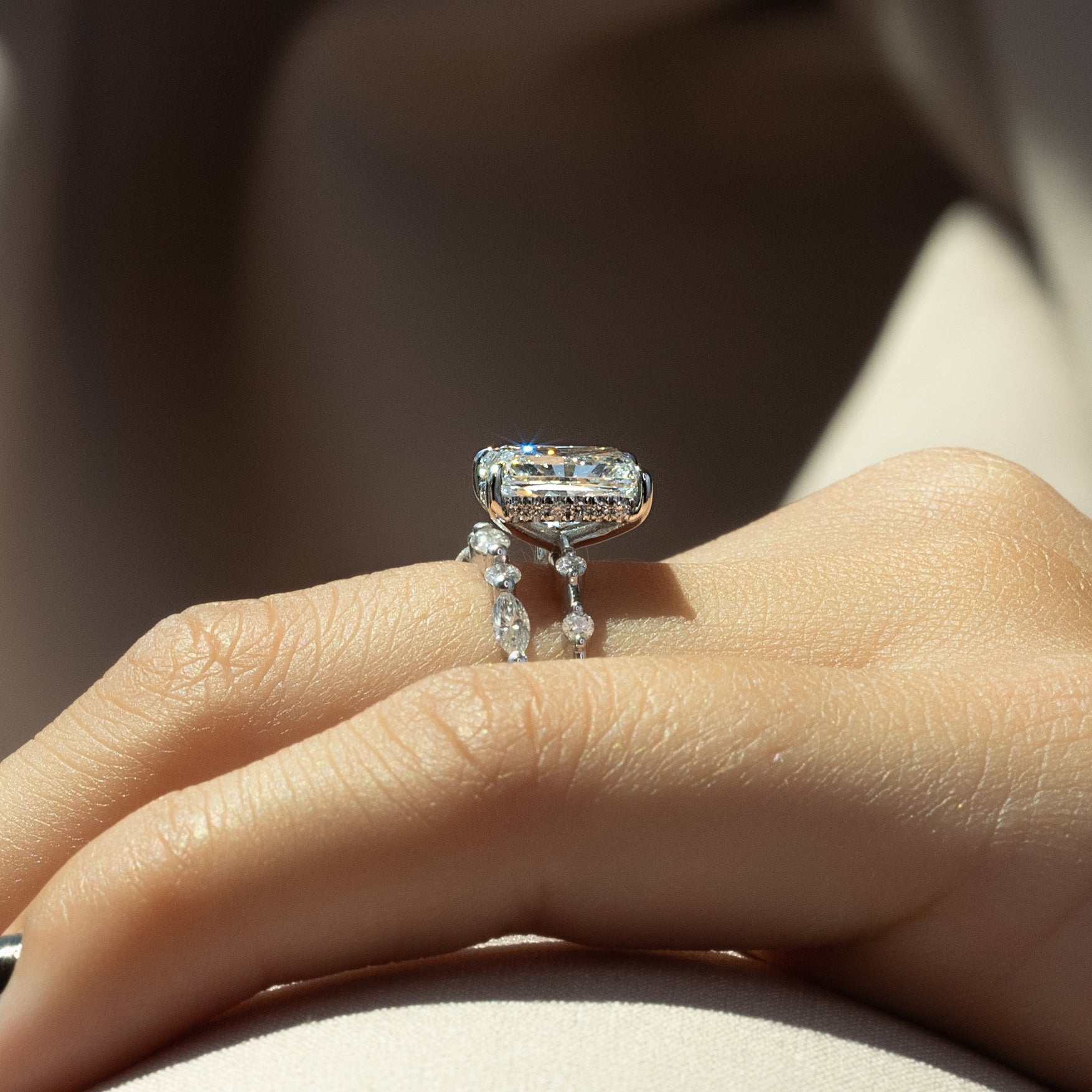 Radiant cut CVD diamond engagement ring with hidden halo in dainty platinum setting
