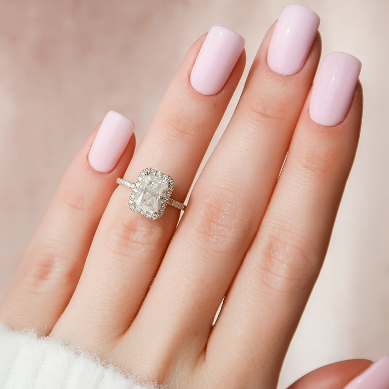 Radiant cut CVD diamond engagement ring with halo setting and pave band, crafted in a modern elegant style