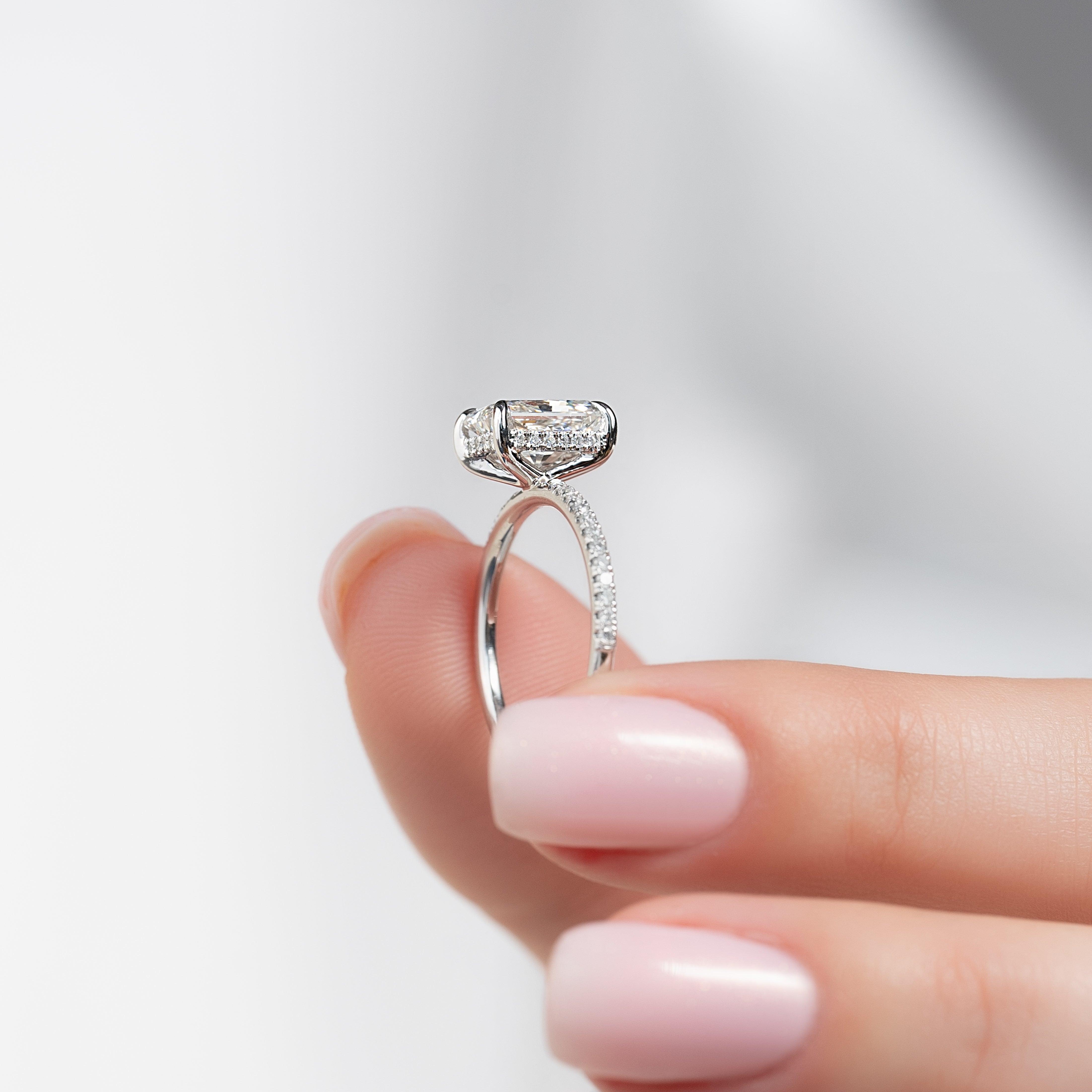 Radiant cut CVD diamond engagement ring with hidden halo and pave diamond band in white gold