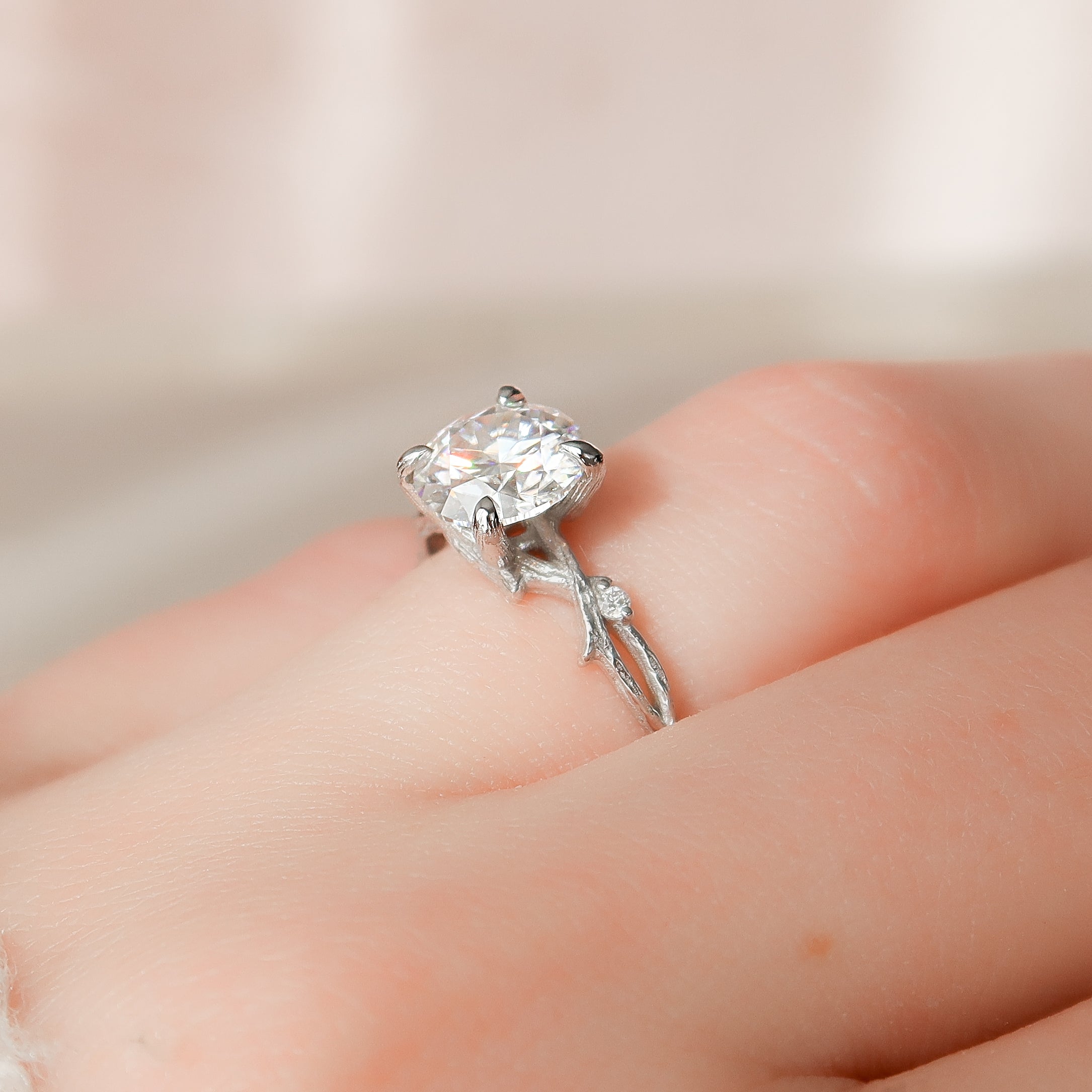 Round cut CVD diamond engagement ring with twig-inspired band in white gold