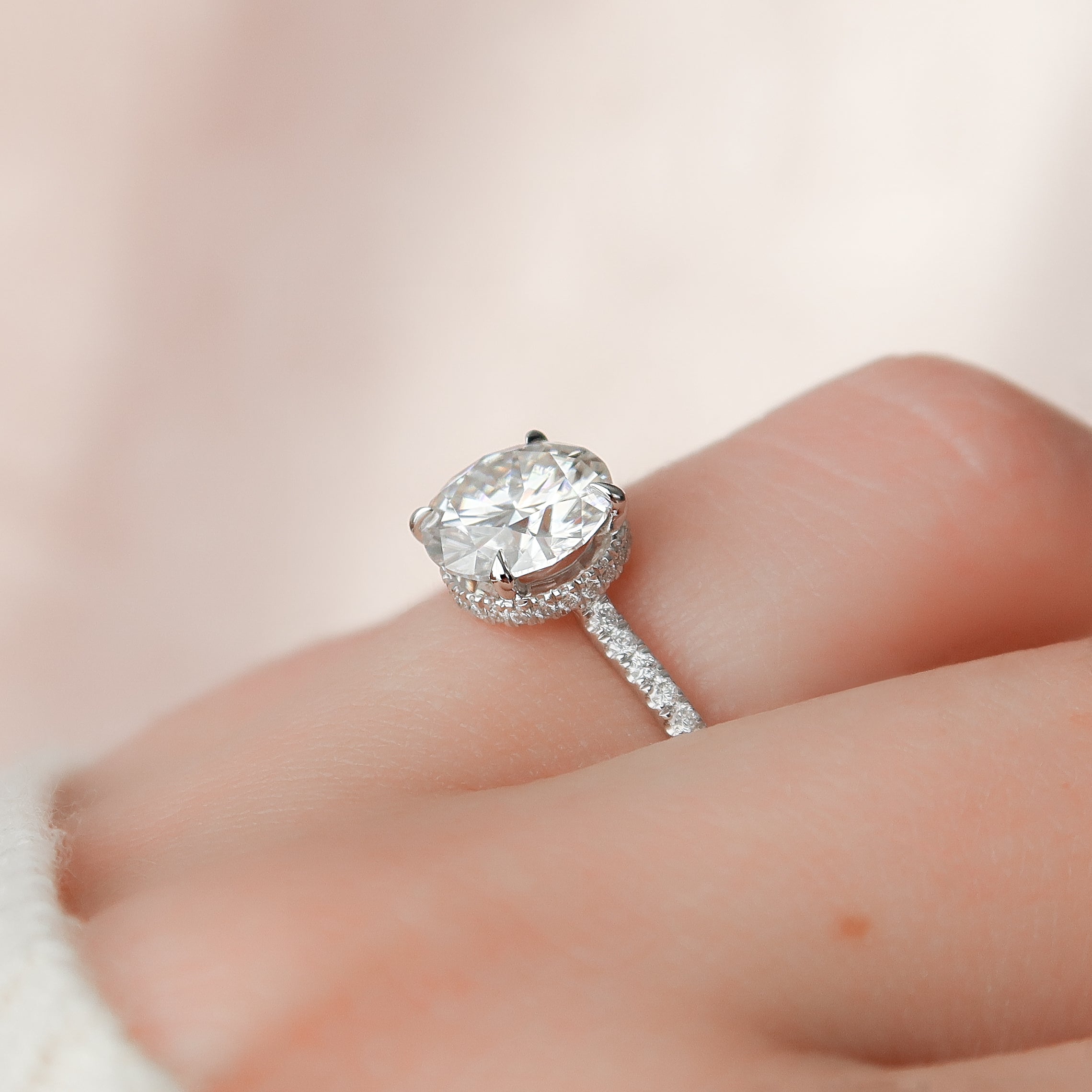 Round cut CVD diamond engagement ring with hidden halo and pave diamond band in white gold
