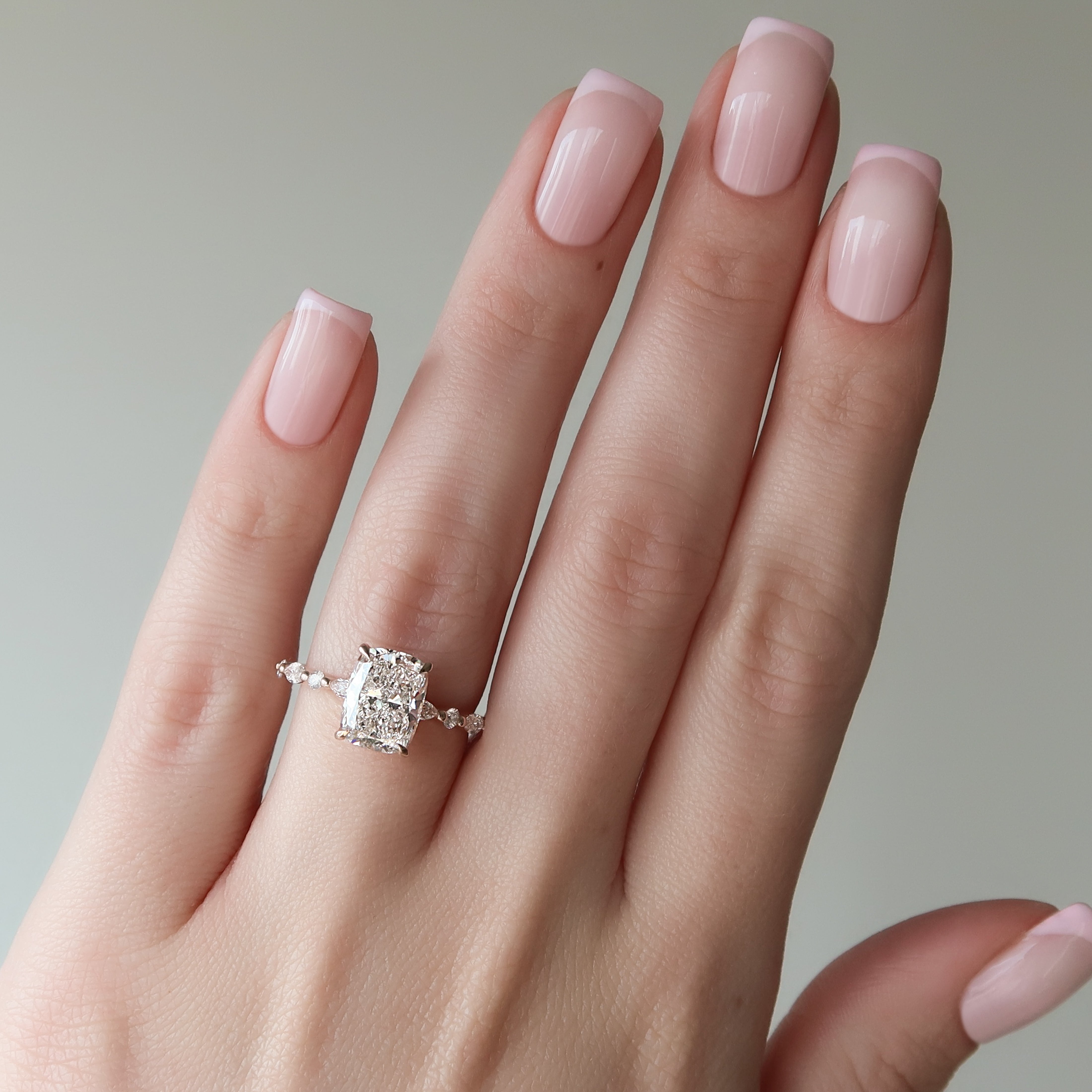 Elongated cushion cut CVD diamond hidden halo engagement ring with pave band in white gold