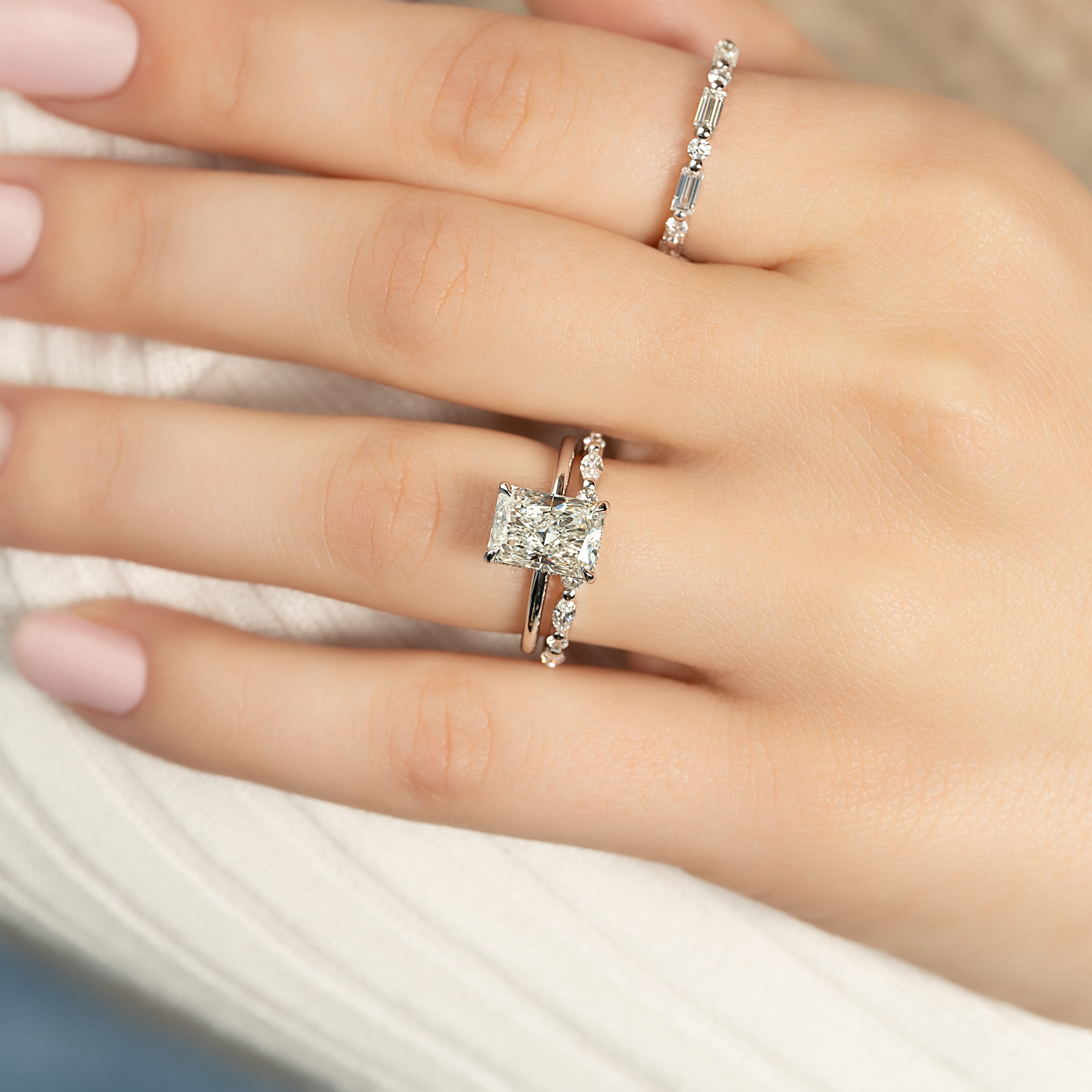 Radiant cut moissanite hidden halo engagement ring in white gold setting