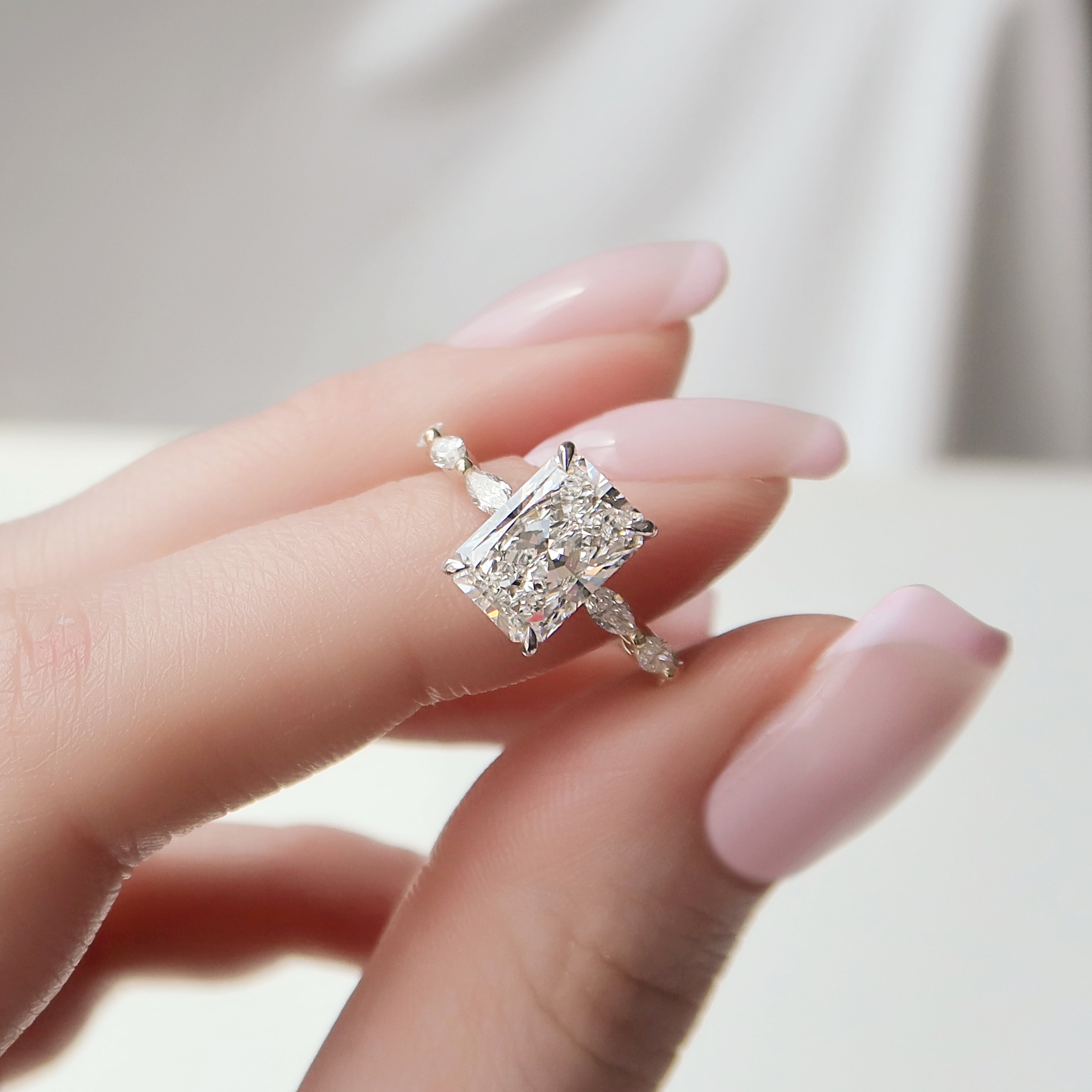Radiant cut CVD diamond engagement ring with hidden halo and pave band in elegant solitaire-inspired style