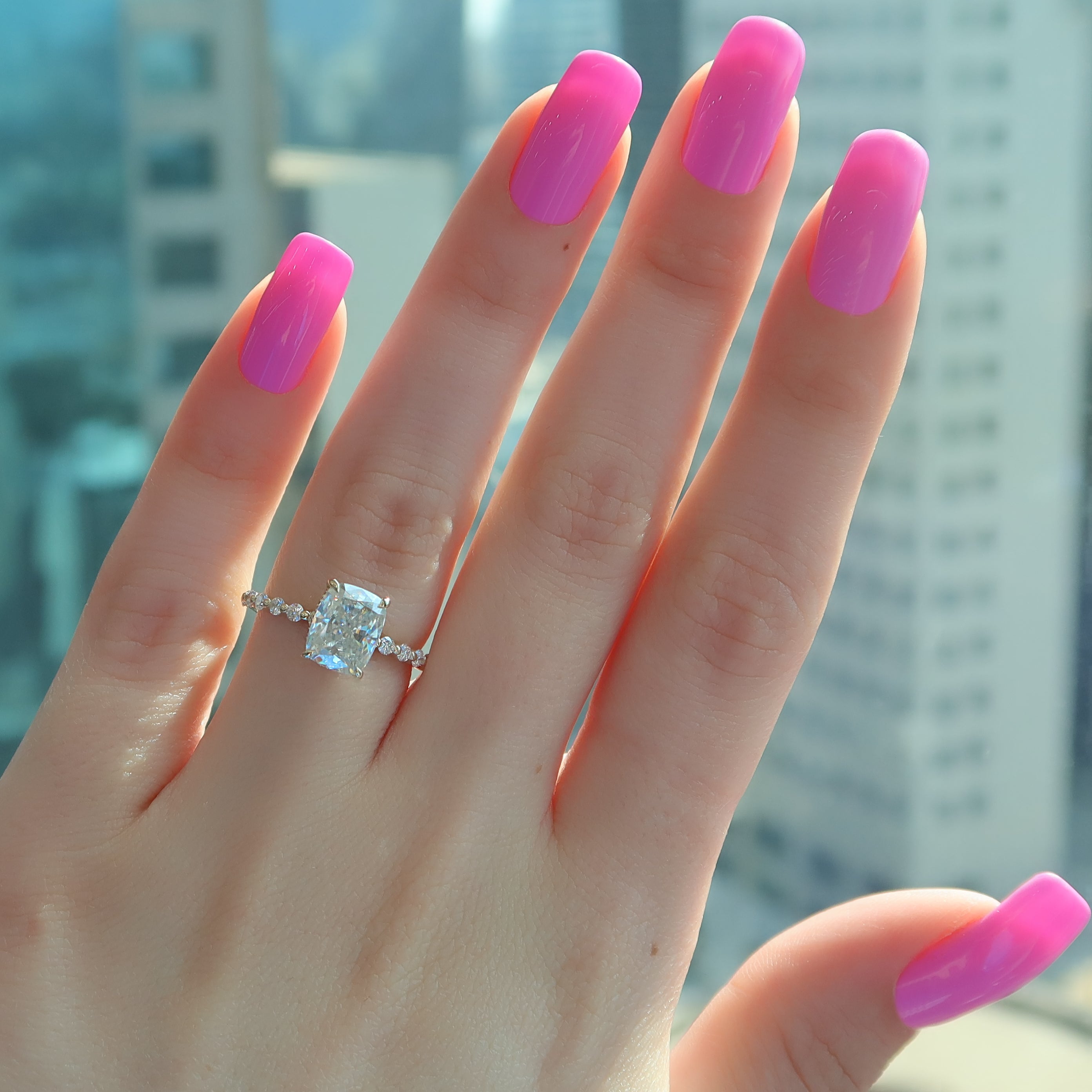 Elongated cushion cut CVD diamond ring with hidden halo and pave style band in platinum