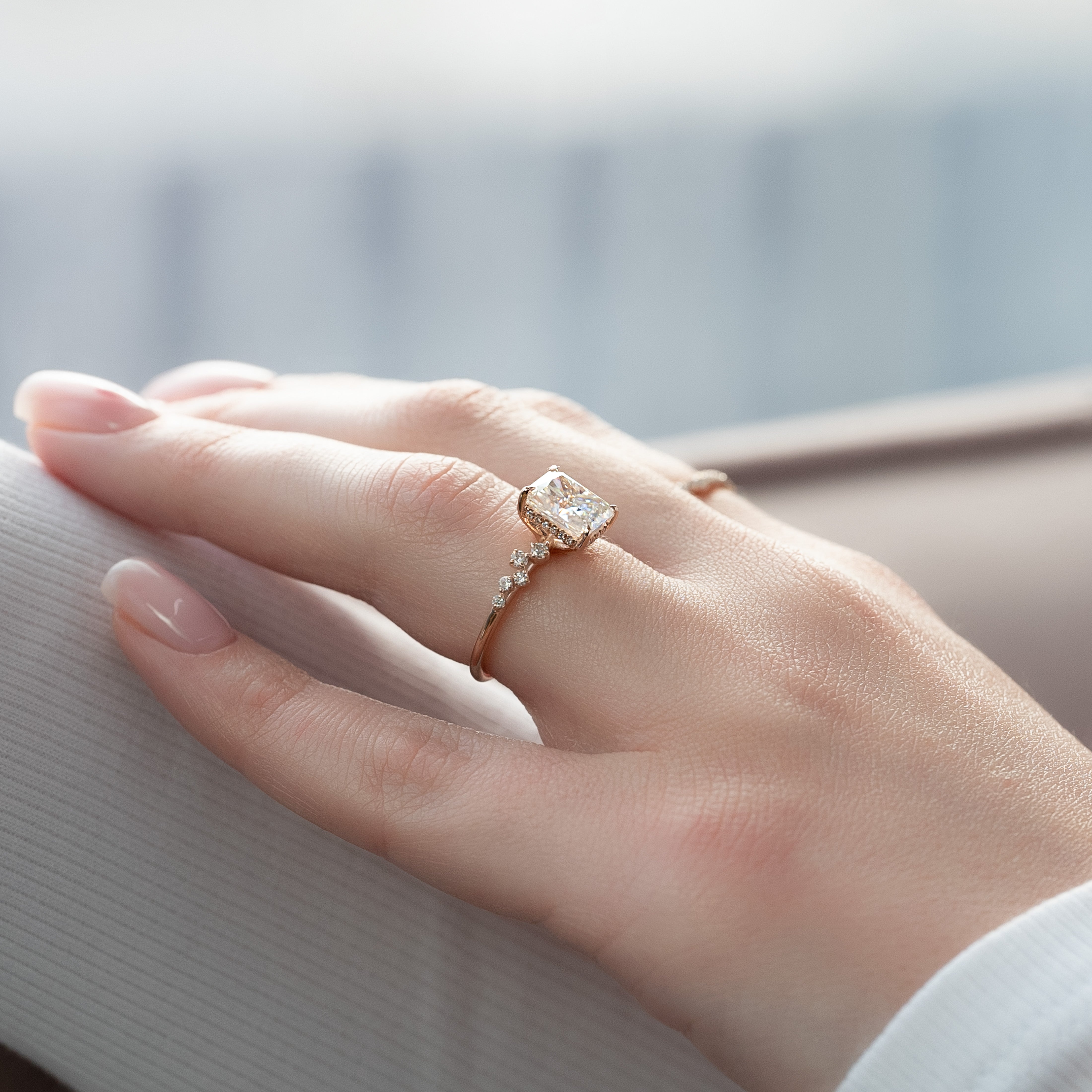 Radiant cut CVD diamond engagement ring with hidden halo and clustered diamond detailing in white gold