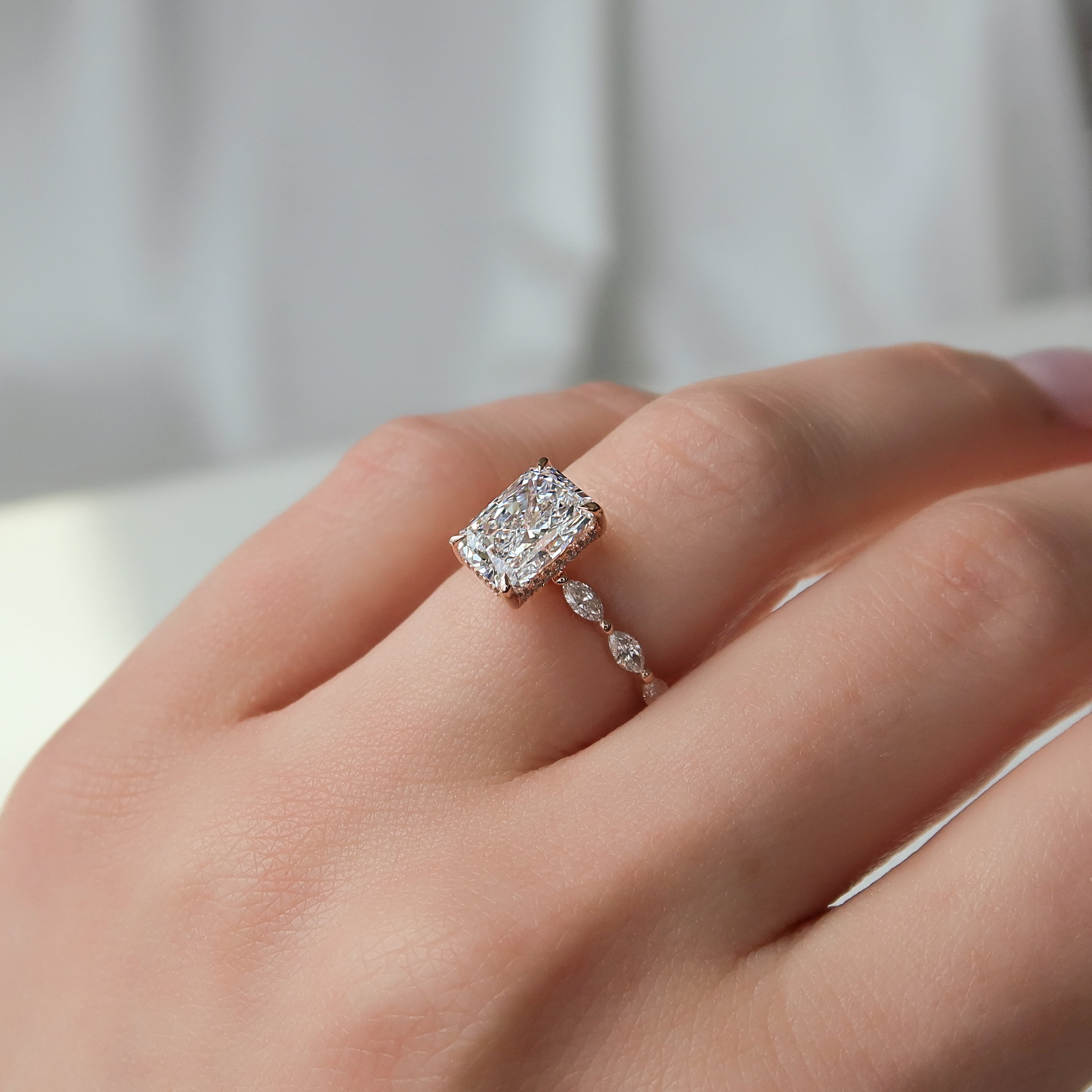 Radiant cut CVD diamond engagement ring with hidden halo and pave band in elegant solitaire-inspired style