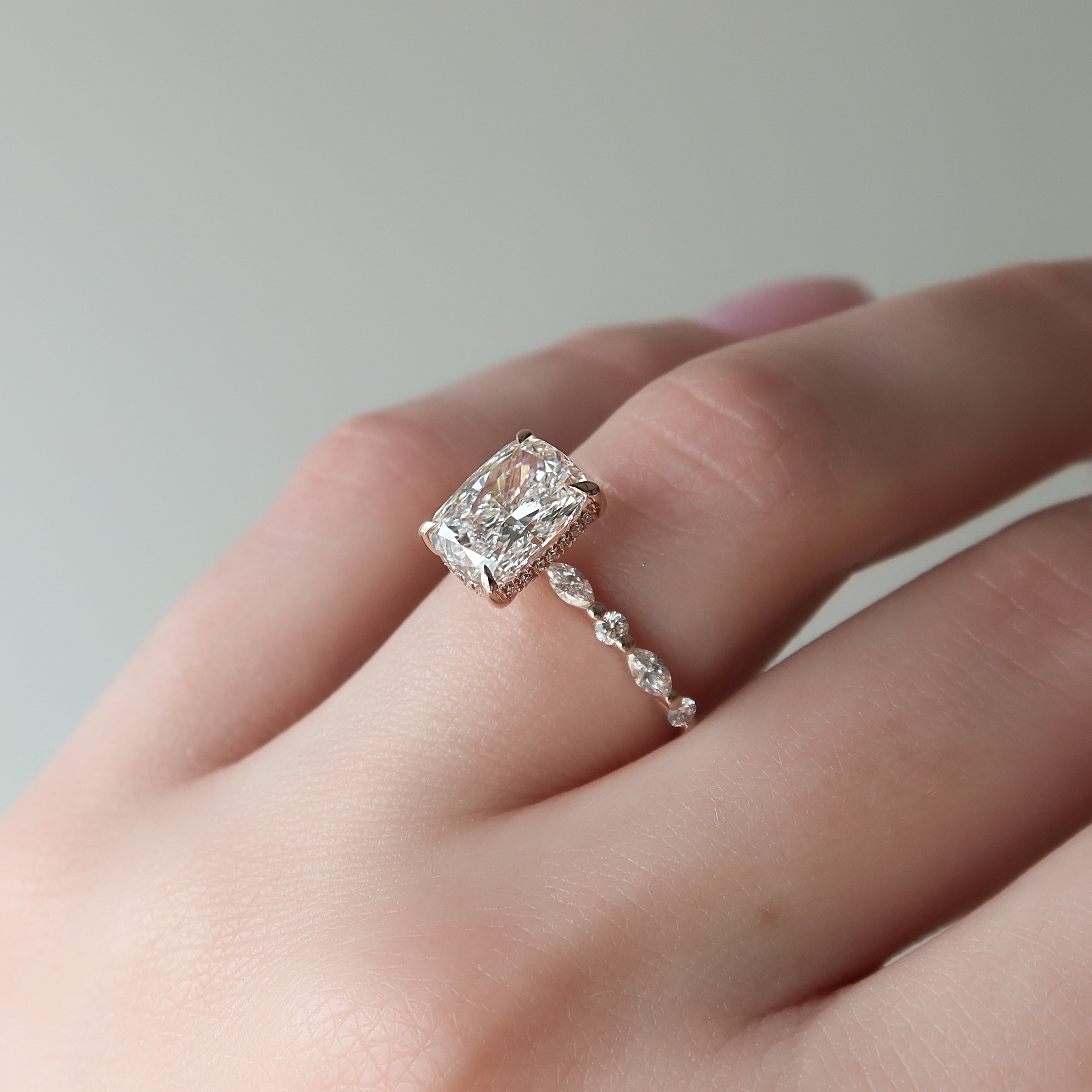 Elongated cushion cut CVD diamond hidden halo engagement ring with pave band in white gold