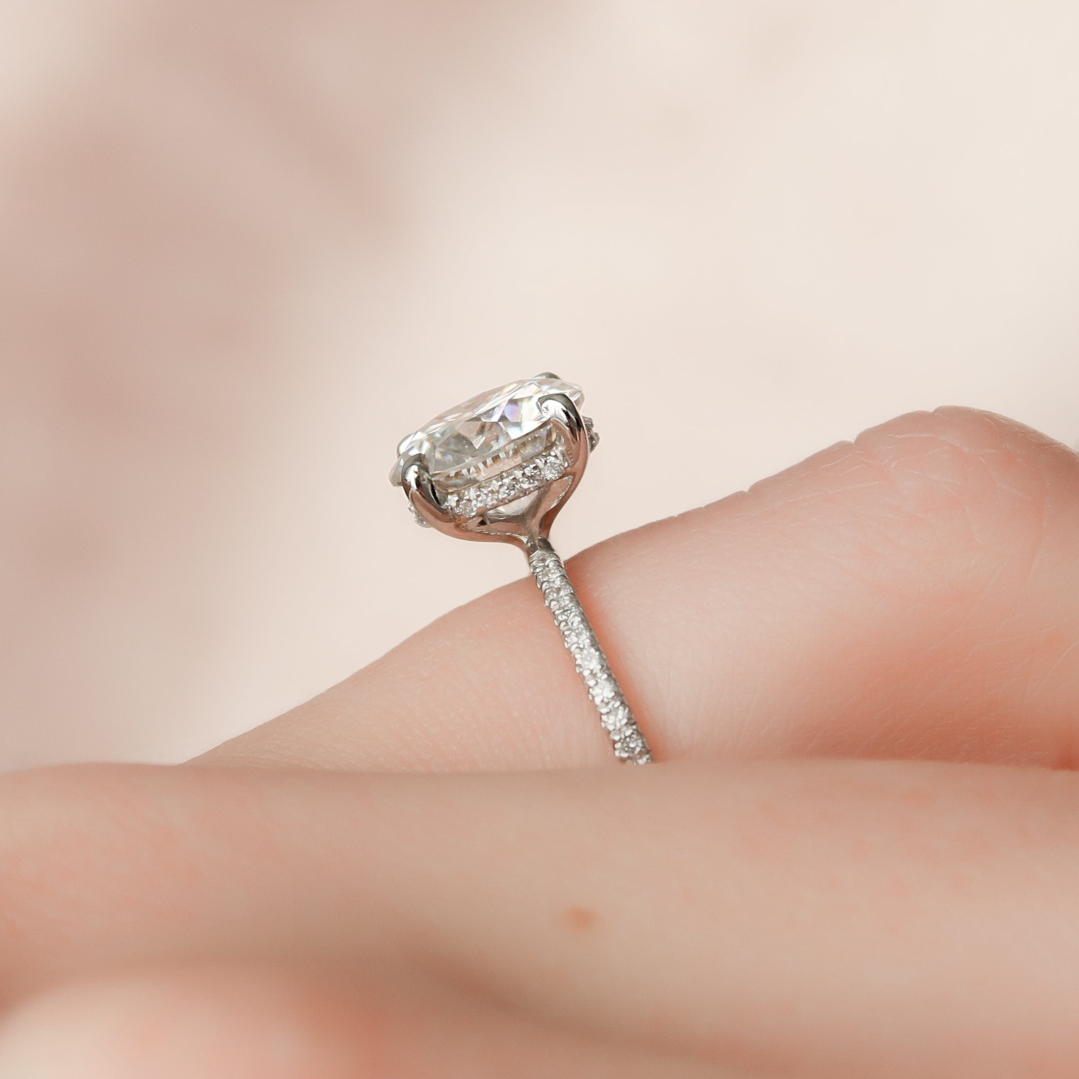 Round cut CVD diamond hidden halo engagement ring with pave band in white gold setting