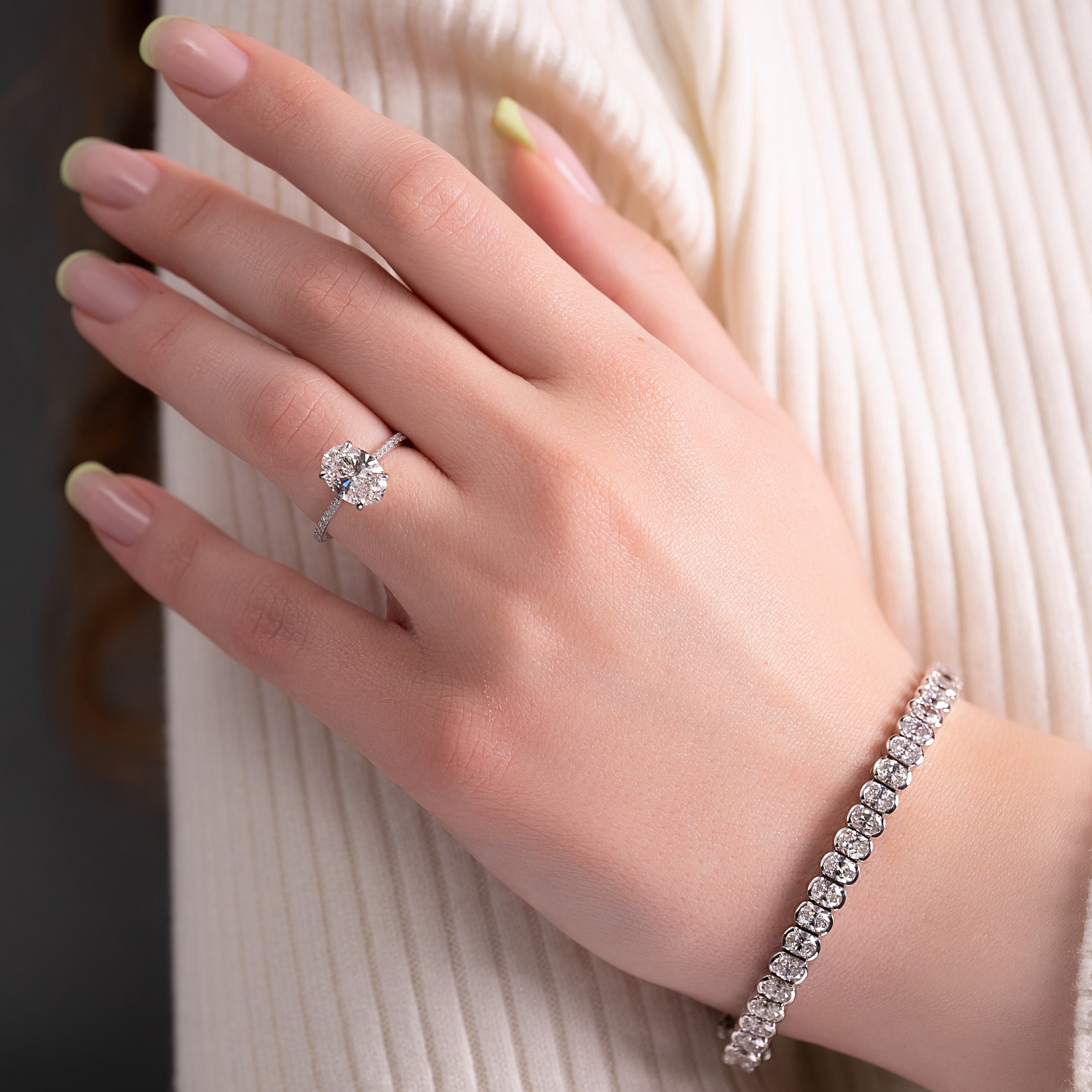 Oval cut CVD diamond engagement ring with pave diamond band in platinum setting