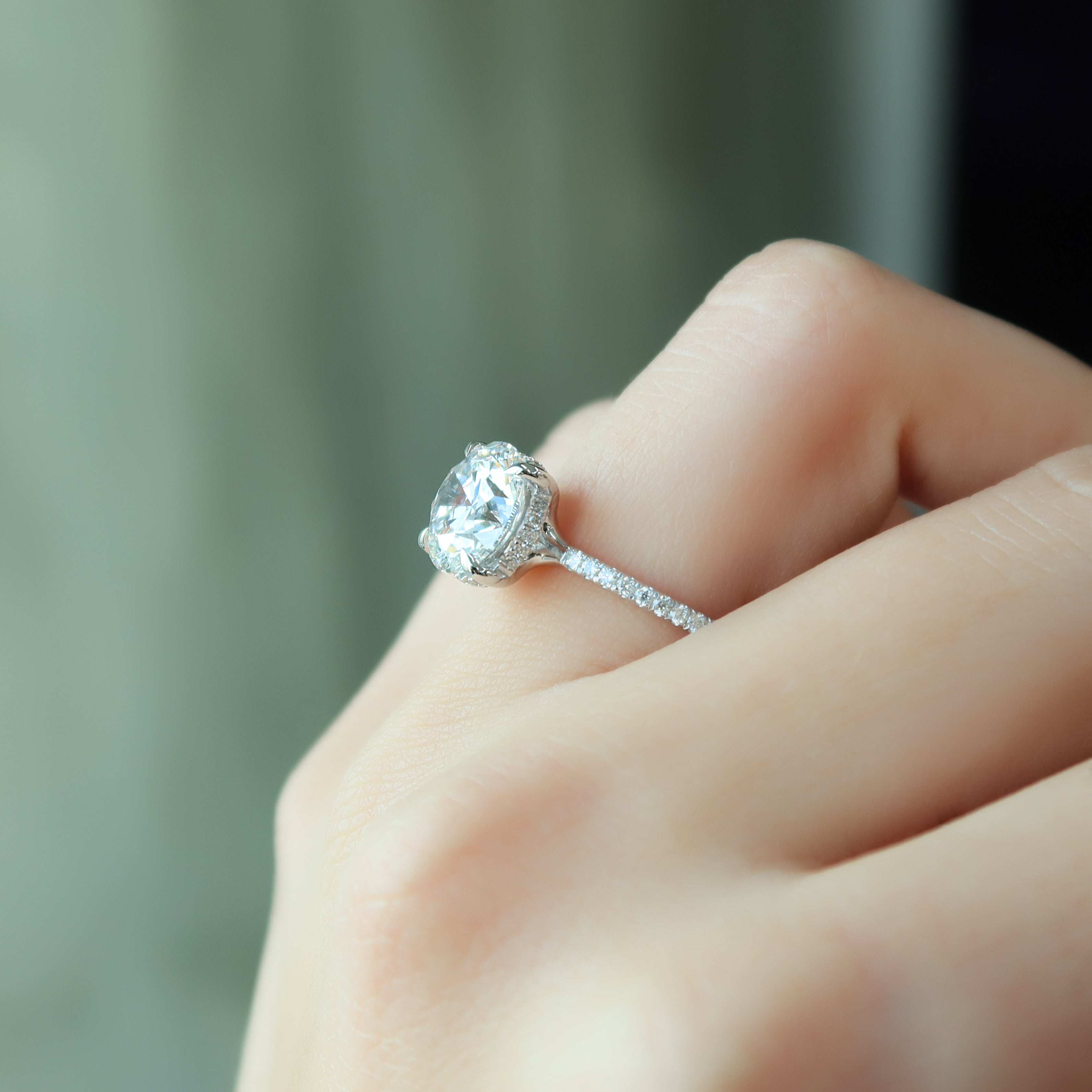 Round cut CVD diamond engagement ring with hidden halo and pave diamond band in white gold