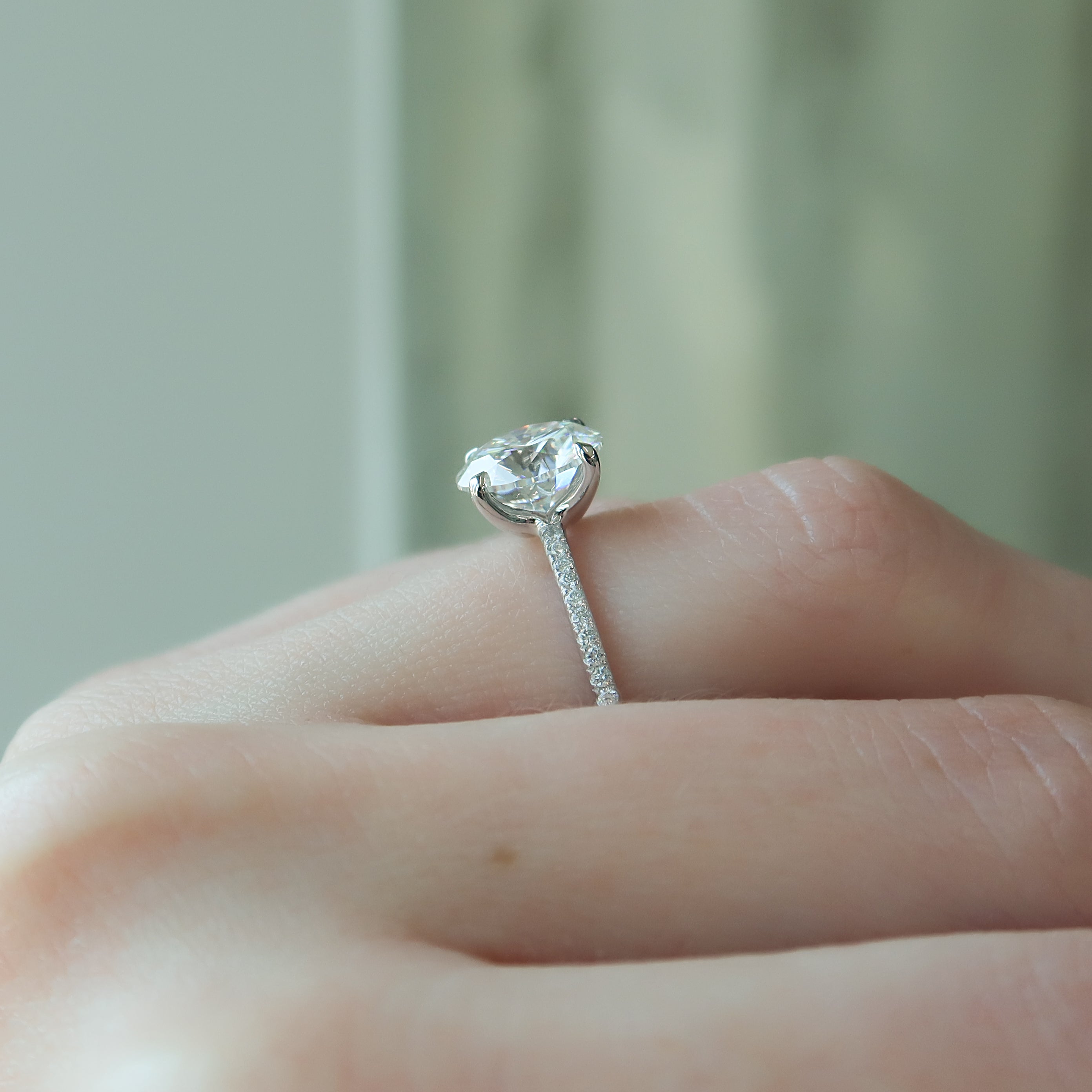 Round cut CVD diamond engagement ring featuring pave diamond band in platinum setting