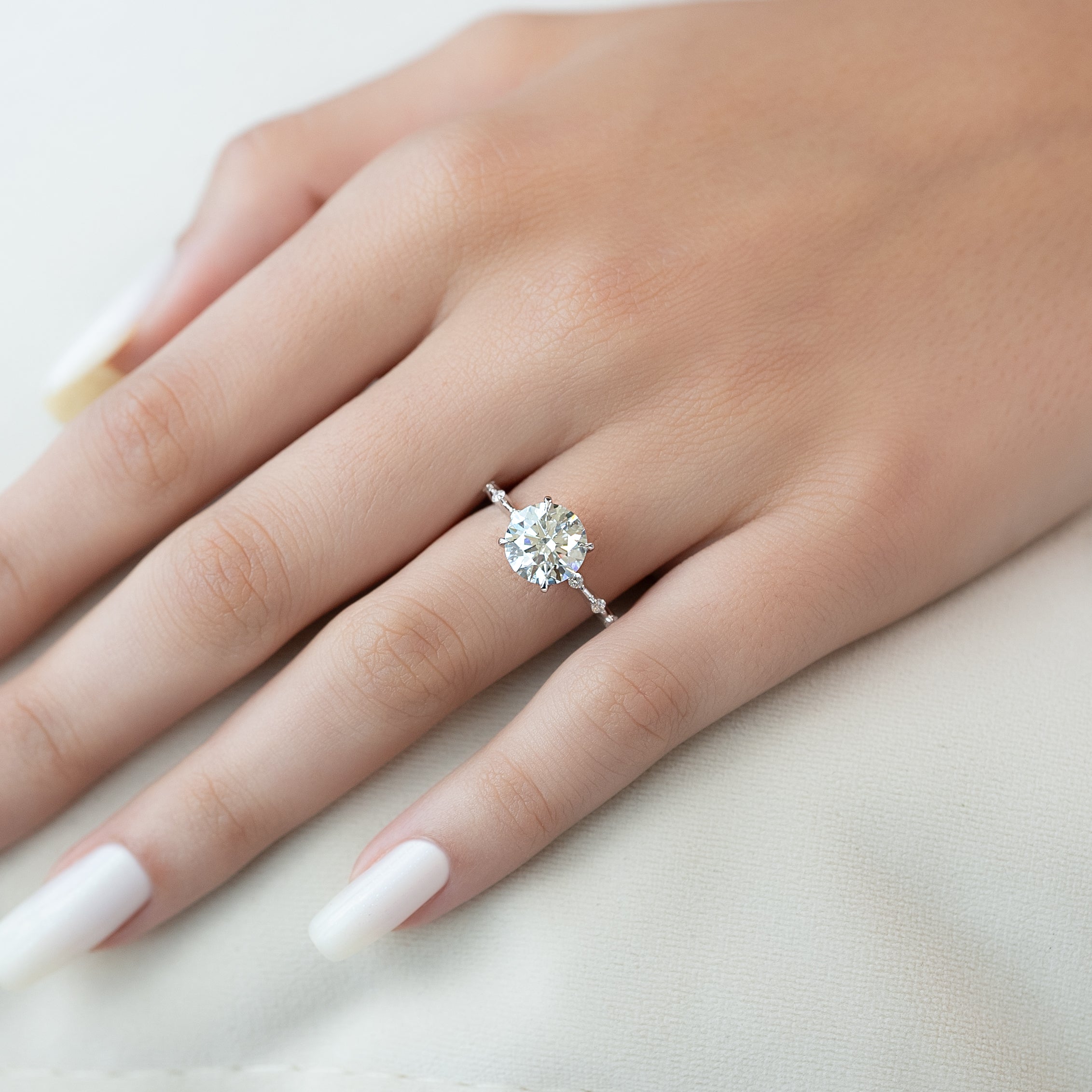 Round cut CVD diamond engagement ring with hidden halo and pave band in white gold