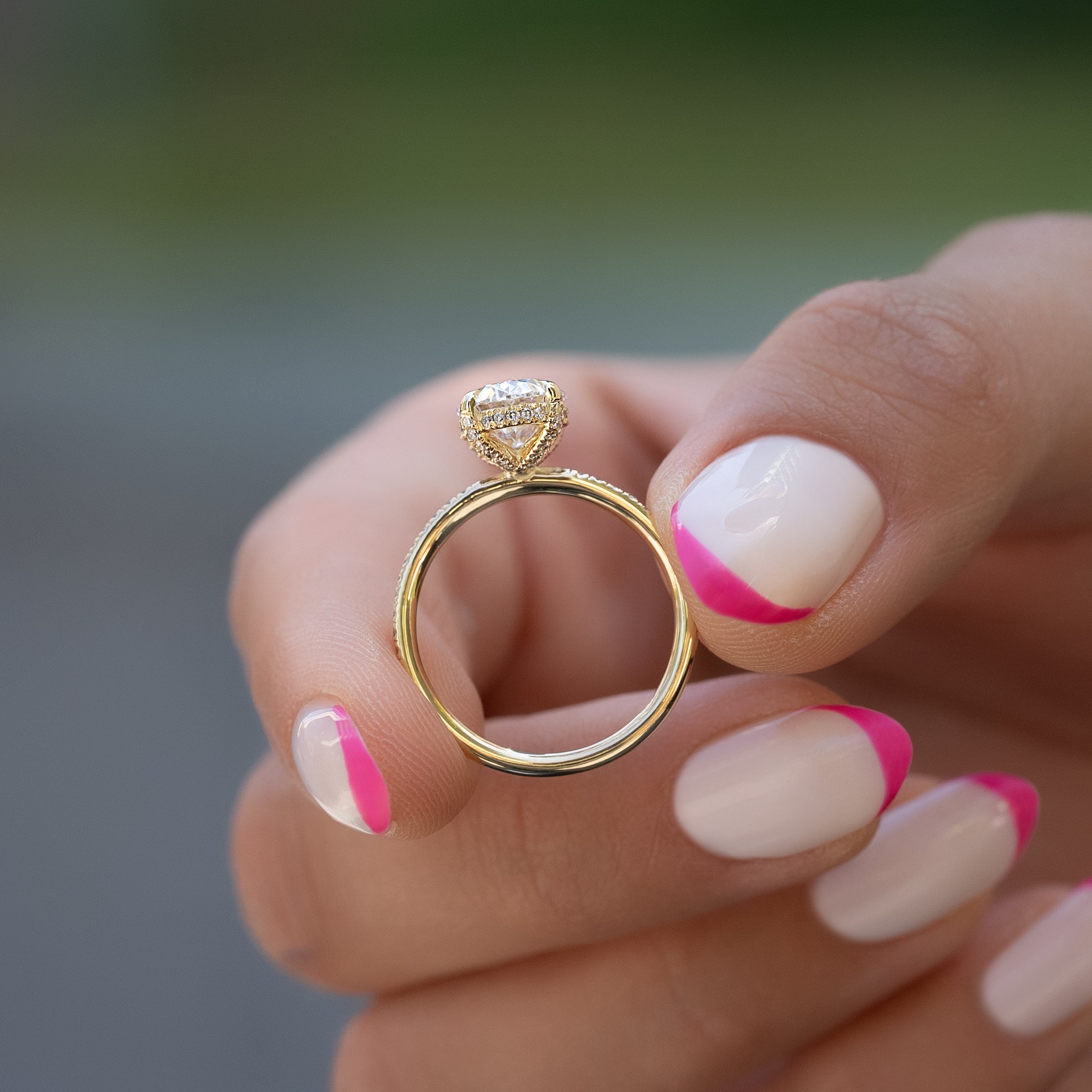 Oval cut CVD diamond engagement ring featuring hidden halo and pave band in platinum