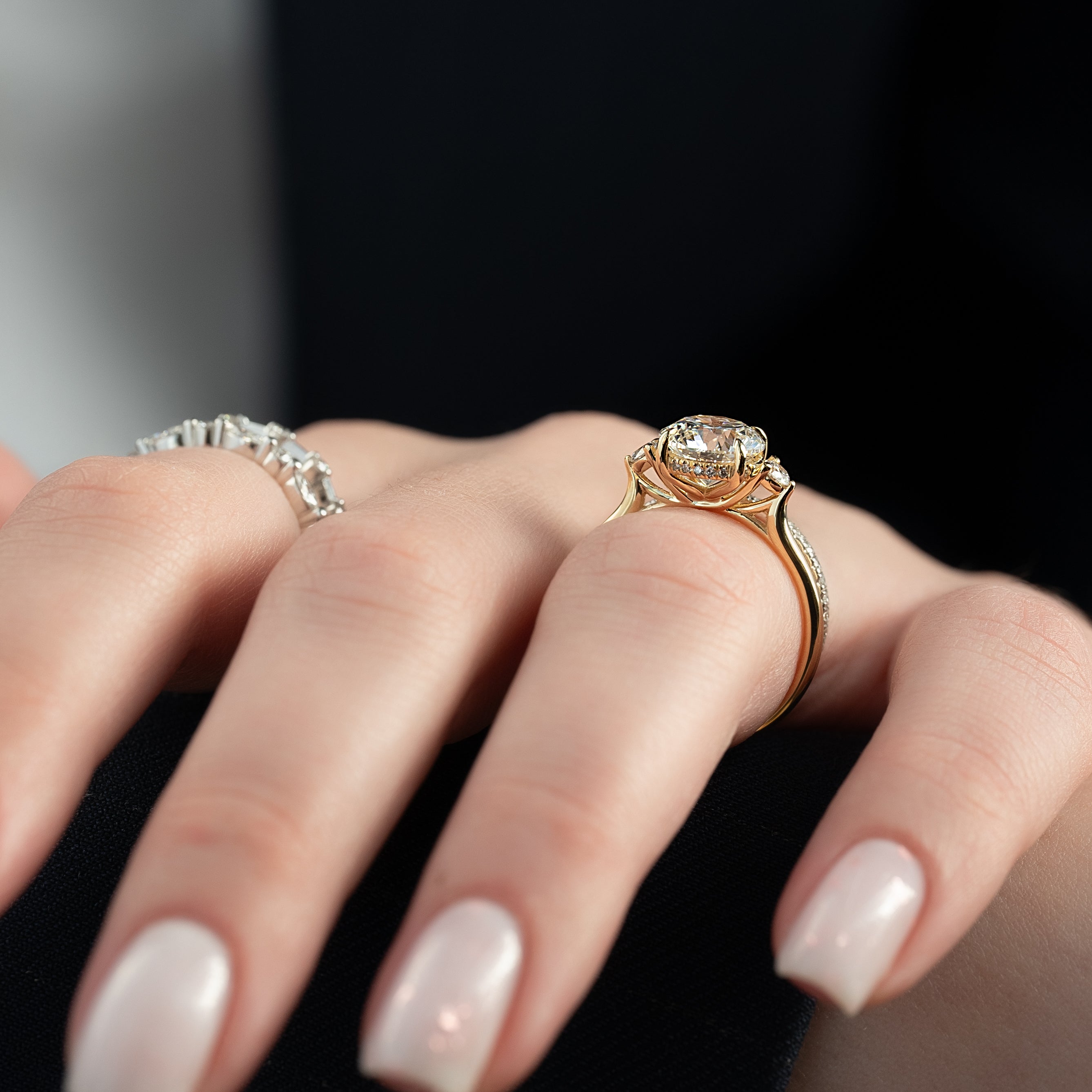 Round cut CVD diamond three-stone engagement ring in platinum setting