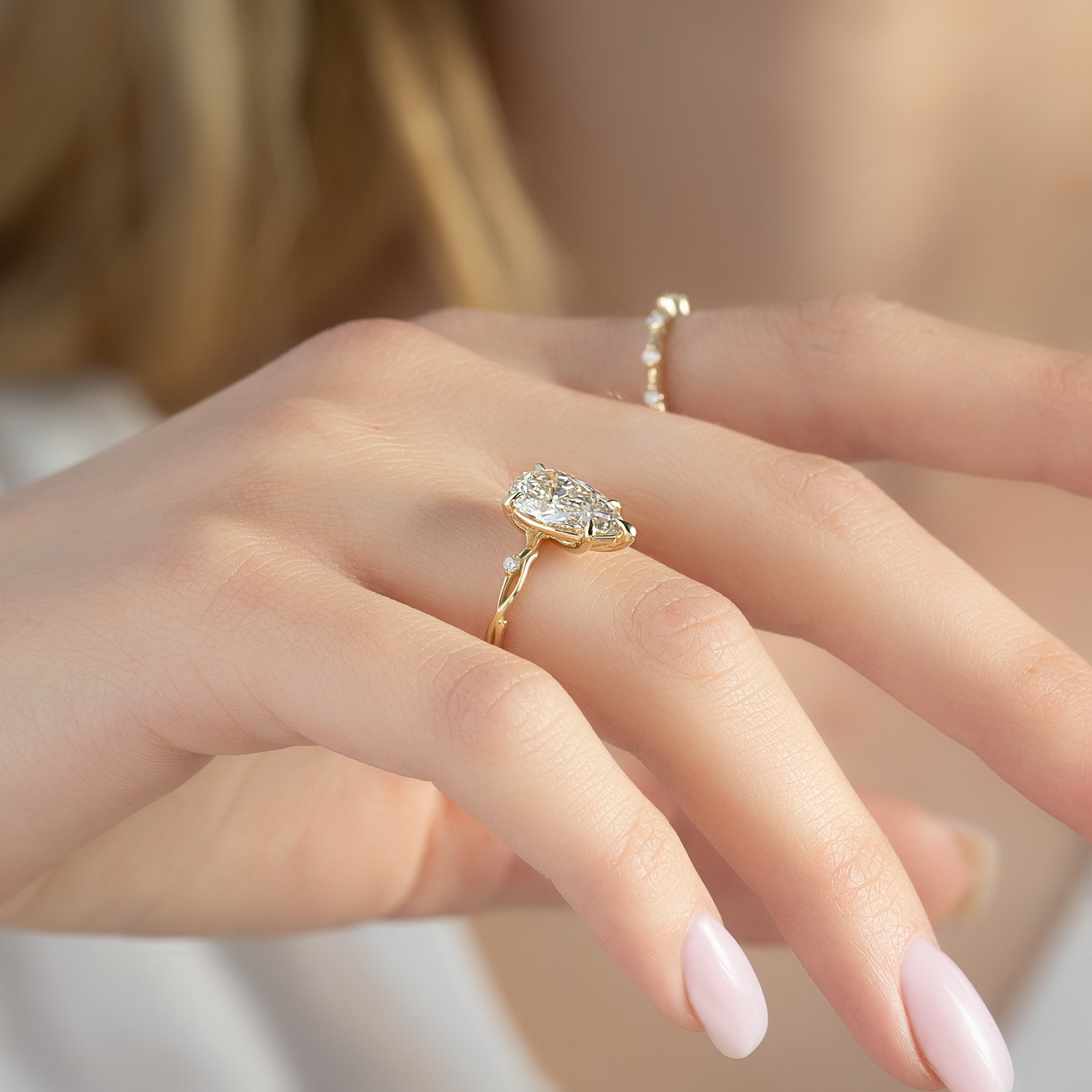 Pear cut CVD diamond engagement ring in twig-style band with organic detailing