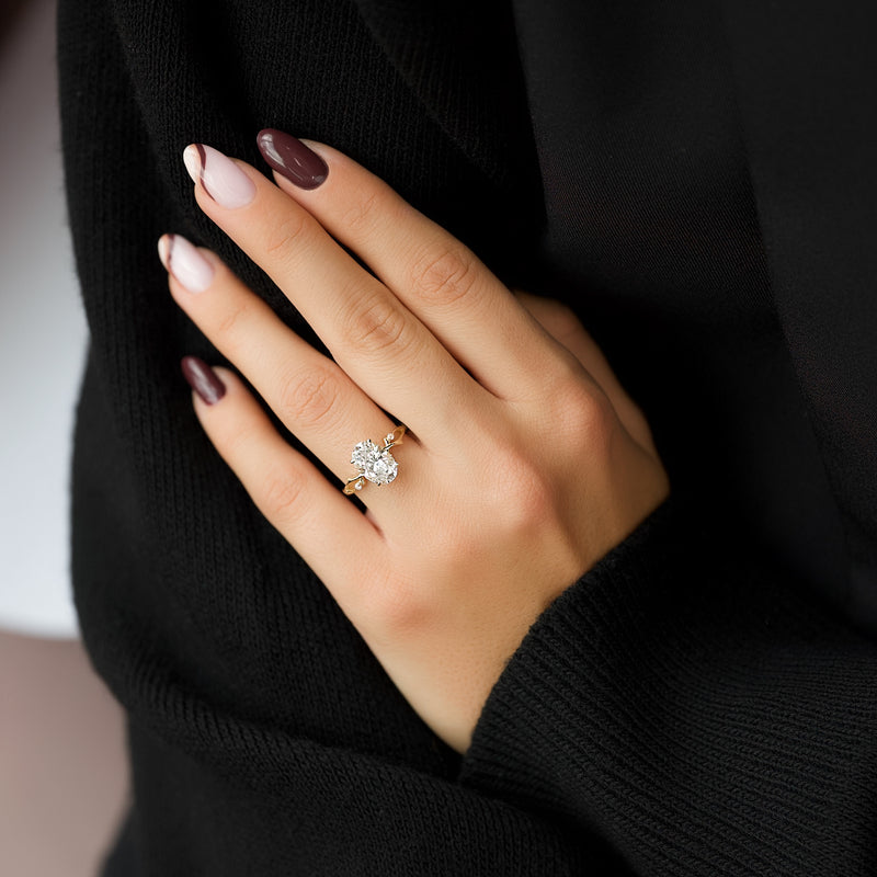 Oval cut CVD diamond engagement ring with twig-style band in white gold