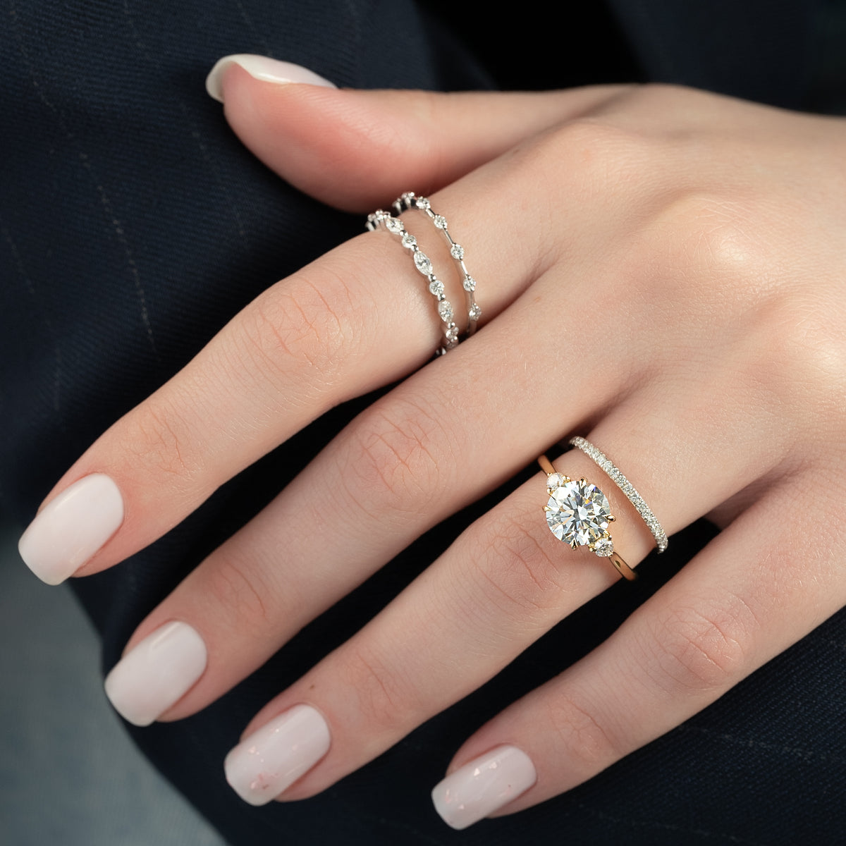 Round cut CVD diamond three-stone engagement ring in platinum setting