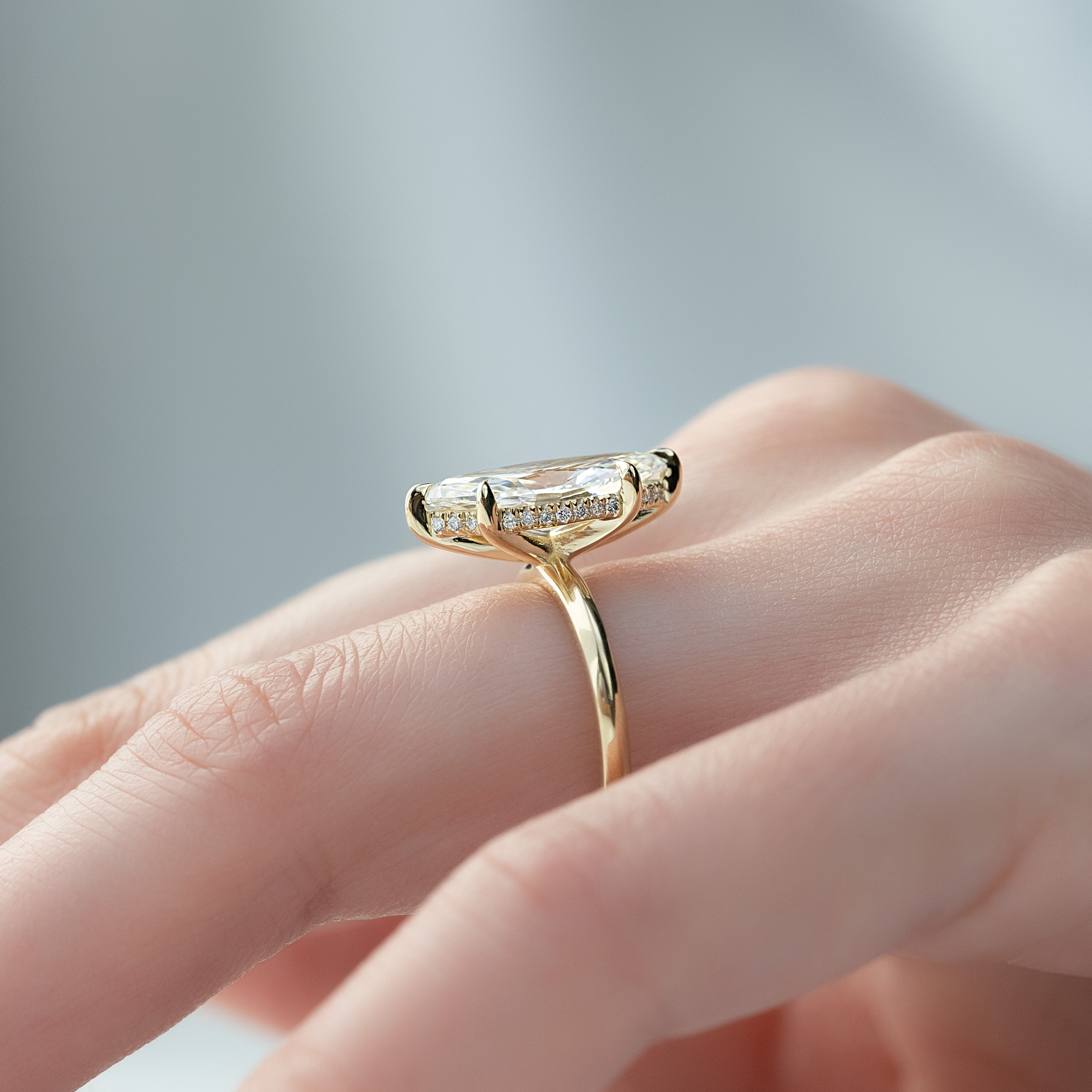 Marquise cut CVD diamond hidden halo engagement ring in white gold setting