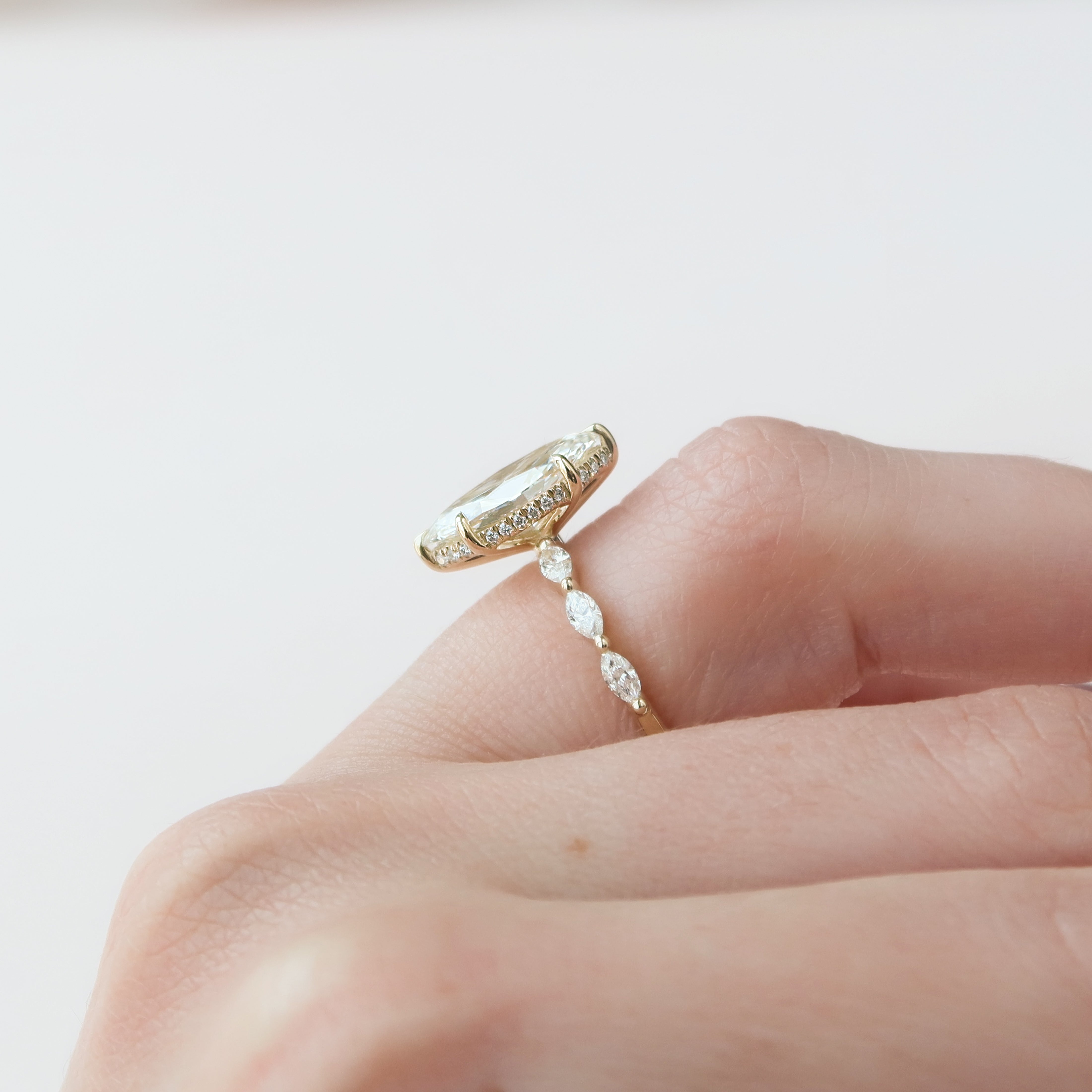 Marquise cut CVD diamond engagement ring with hidden halo and pave band in white gold