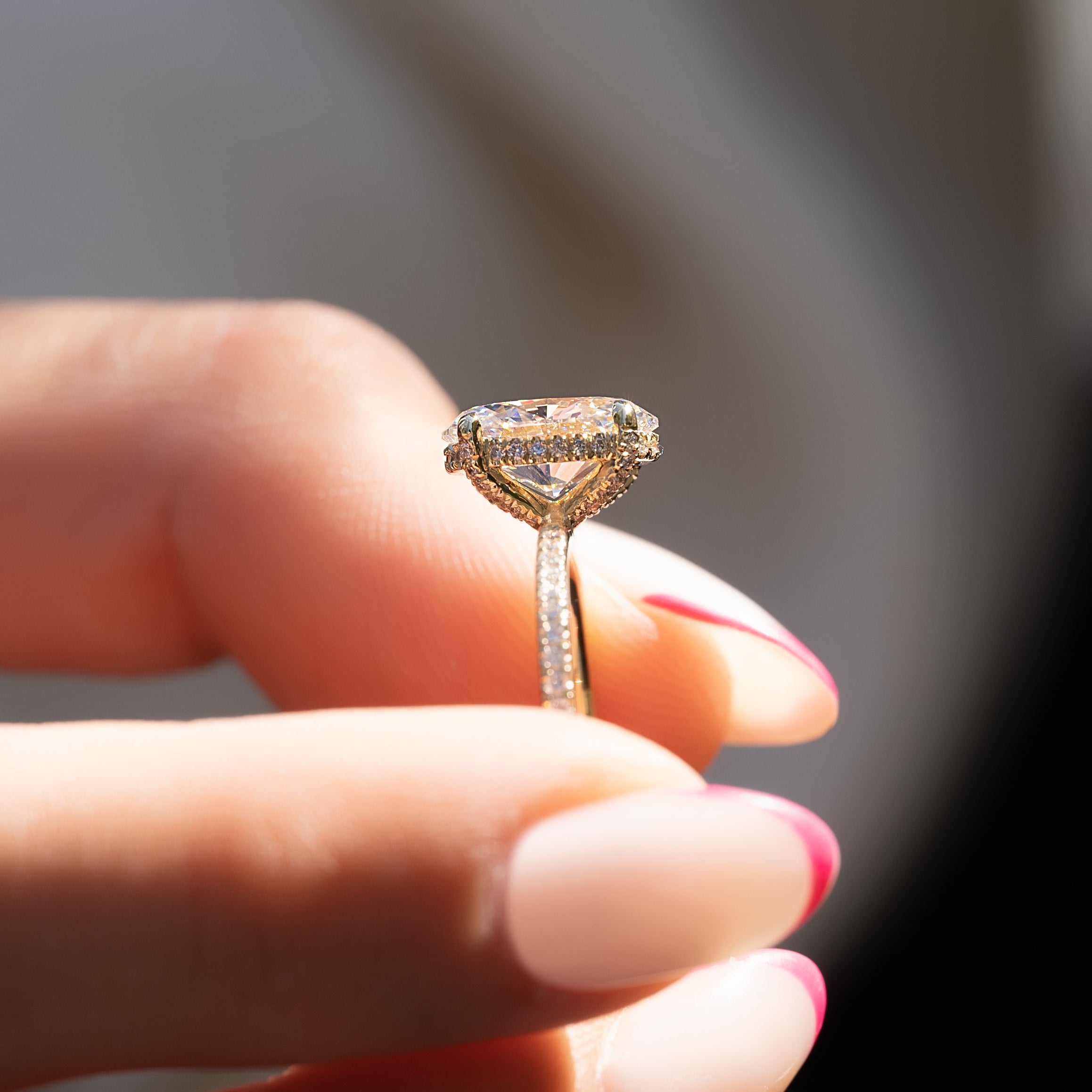 Oval cut CVD diamond engagement ring featuring hidden halo and pave band in platinum