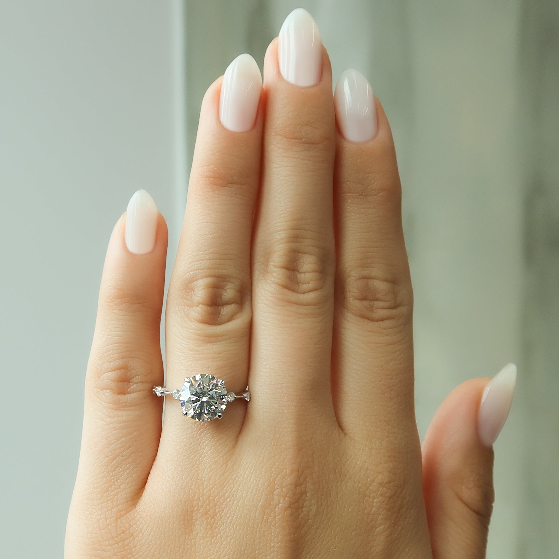 Round cut CVD diamond dainty engagement ring with slim band in white gold