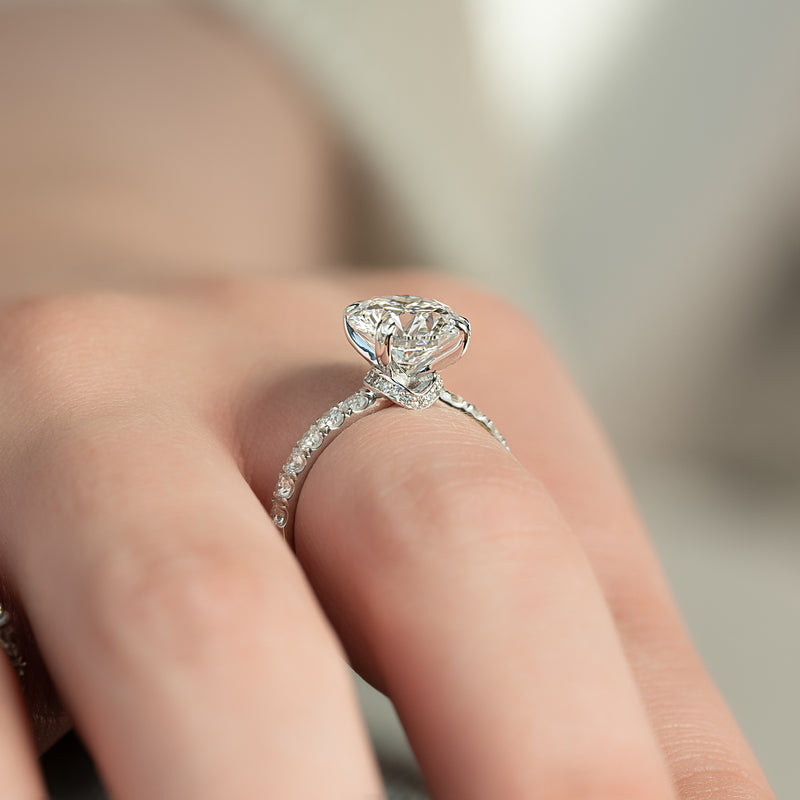 Round cut CVD diamond hidden halo engagement ring with pave band in white gold