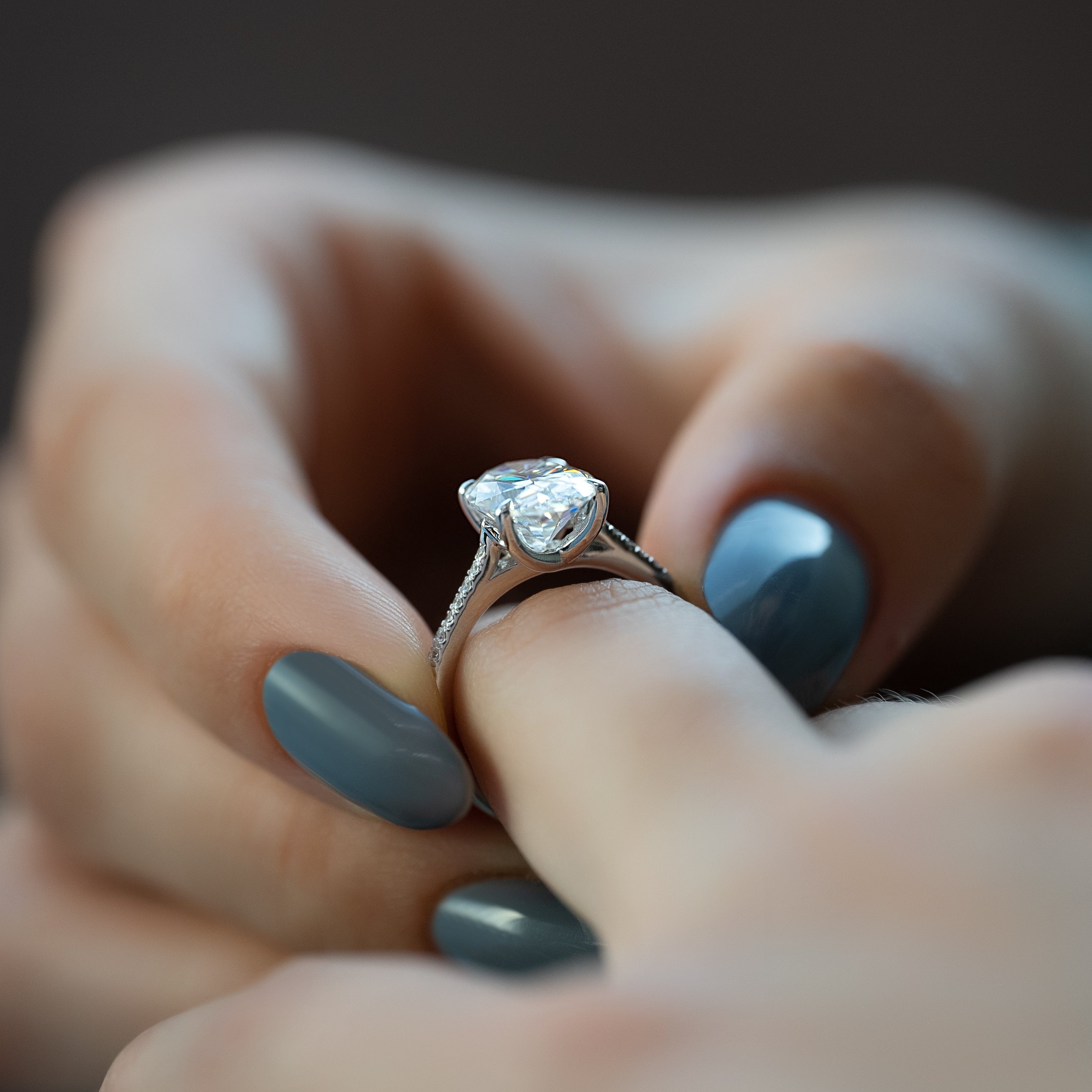 Oval cut CVD diamond engagement ring with pave diamond band in platinum setting