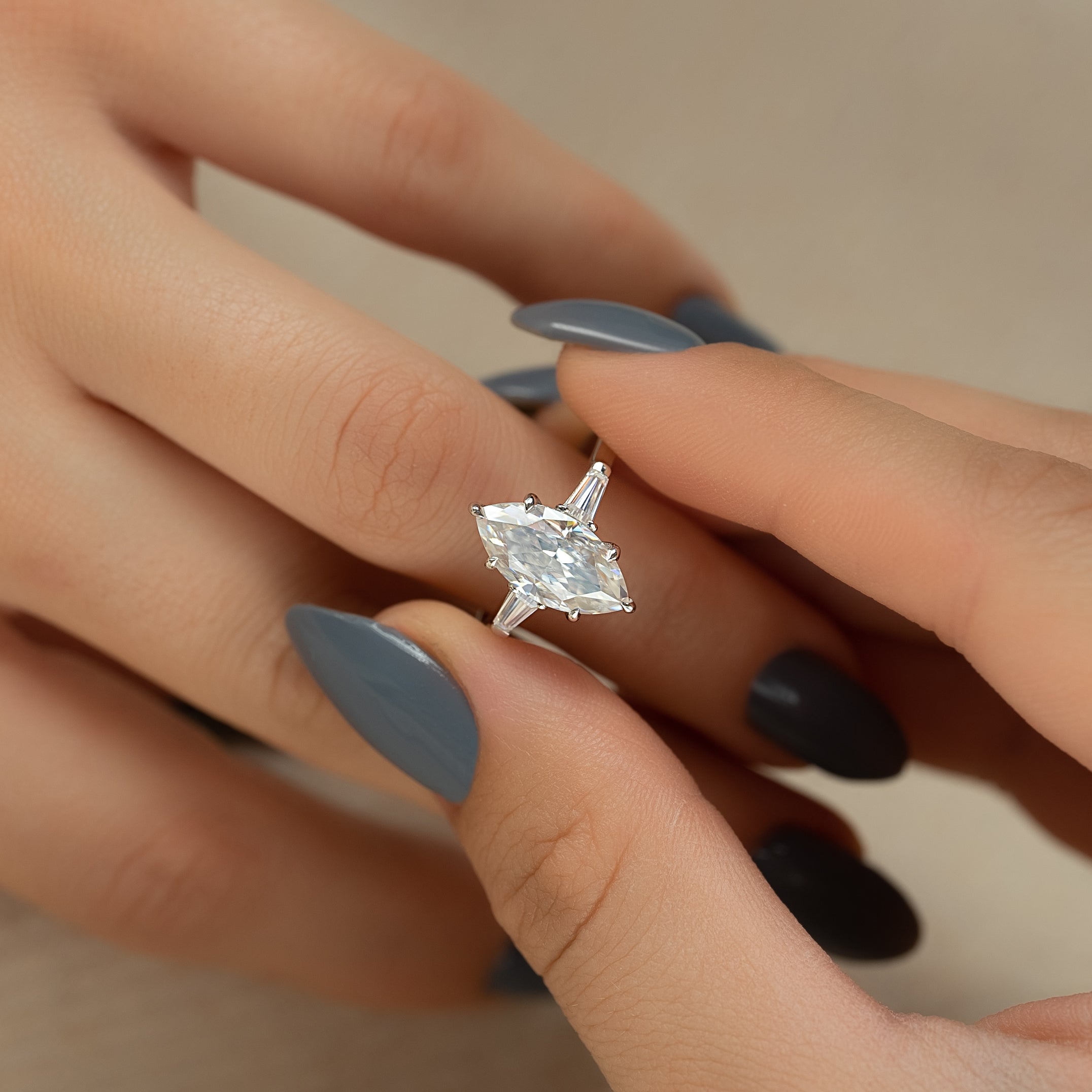 Marquise cut CVD diamond three stone engagement ring in white gold setting