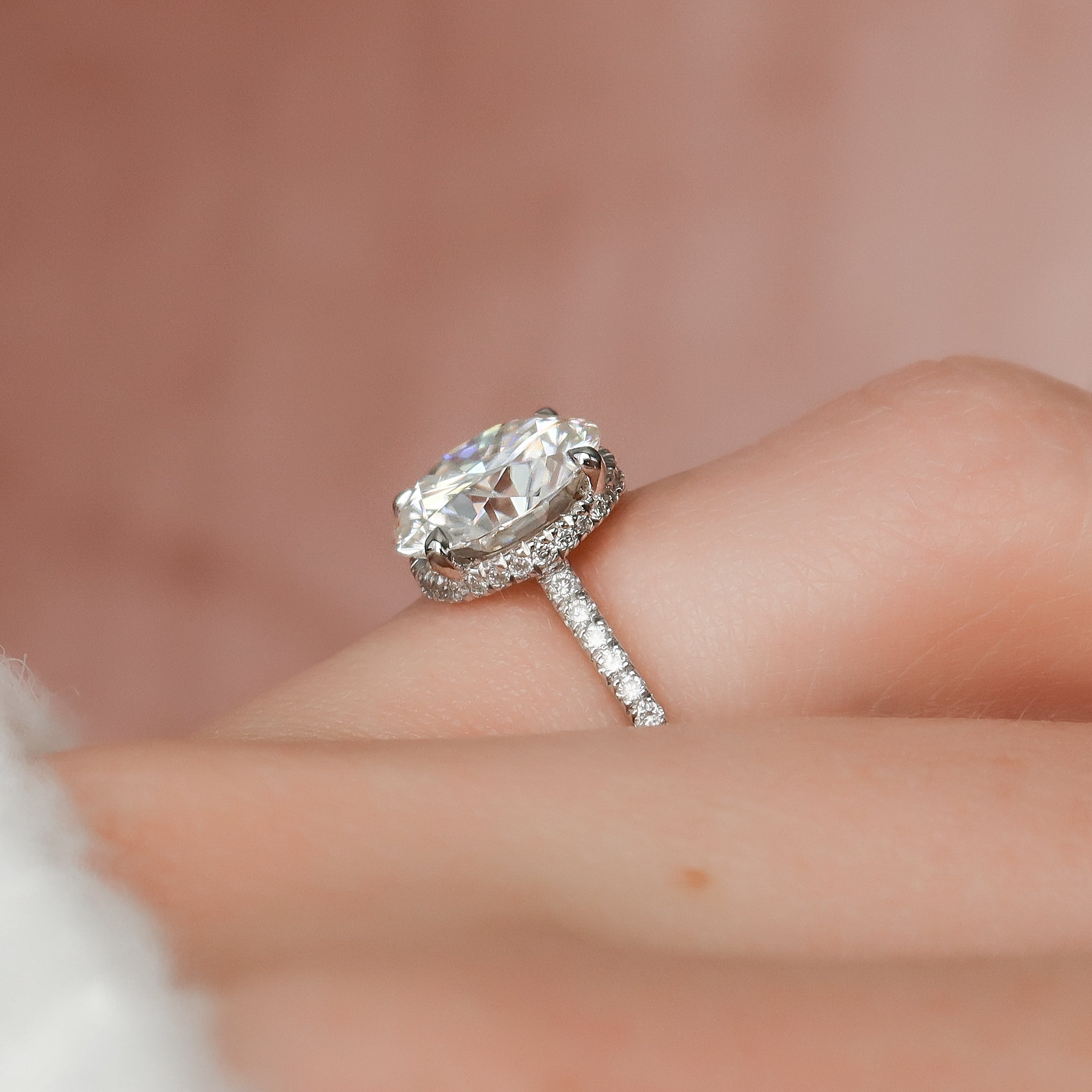 Round cut CVD diamond engagement ring with hidden halo and pave diamond band in white gold