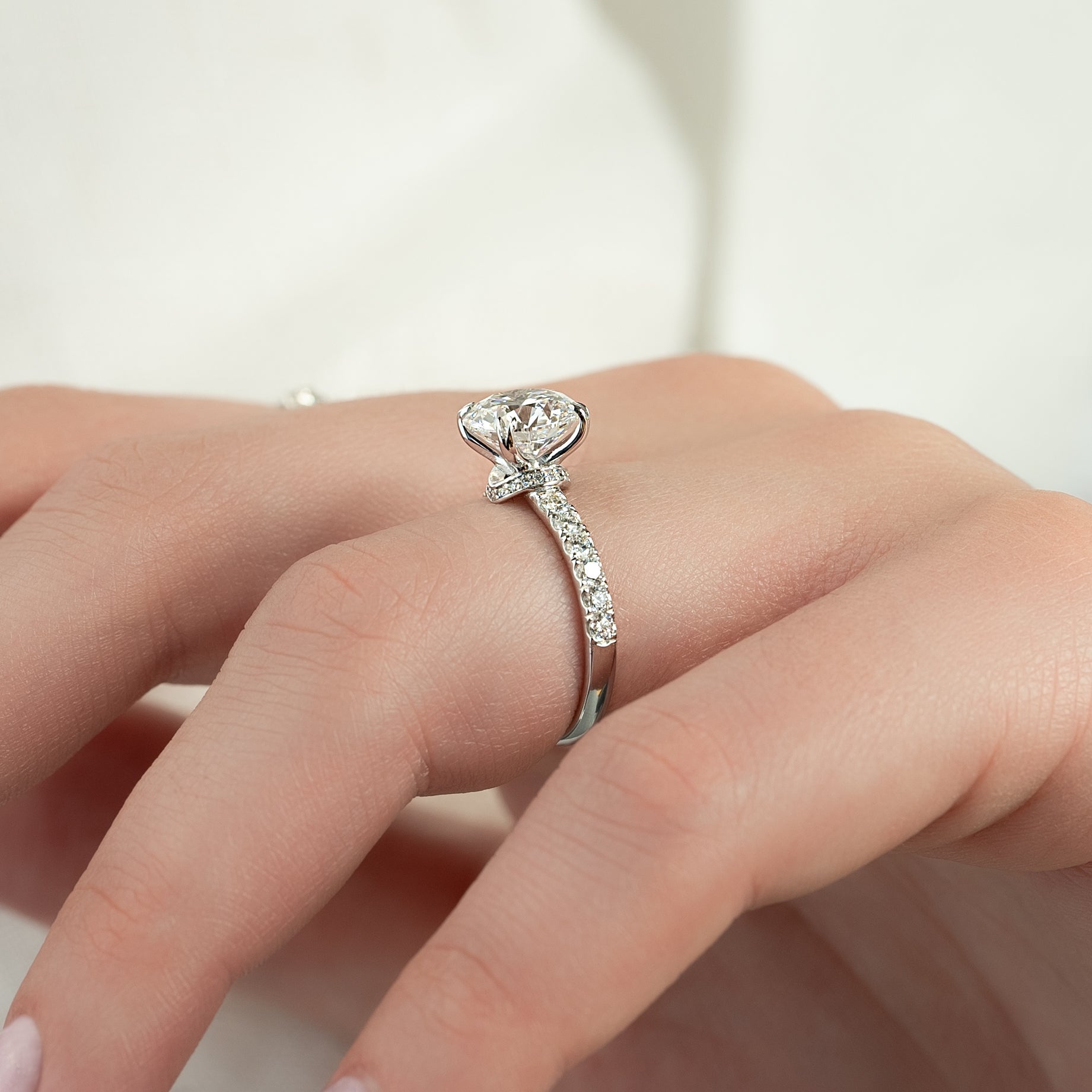 Round cut CVD diamond hidden halo engagement ring with pave band in white gold