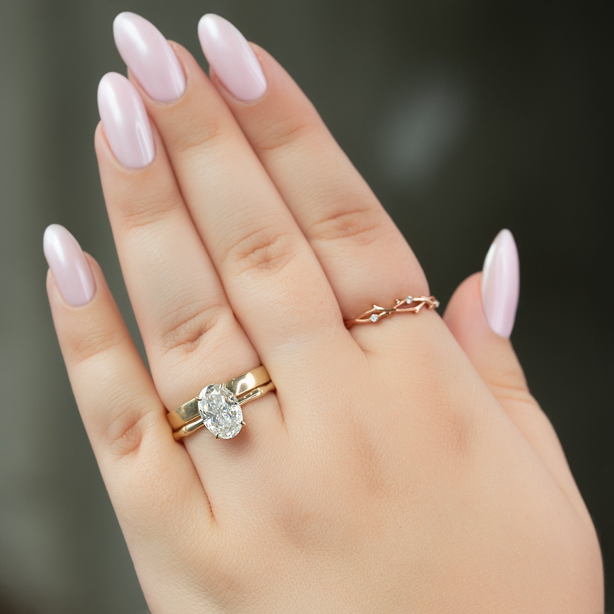Oval cut CVD diamond engagement ring with hidden halo detail in platinum setting