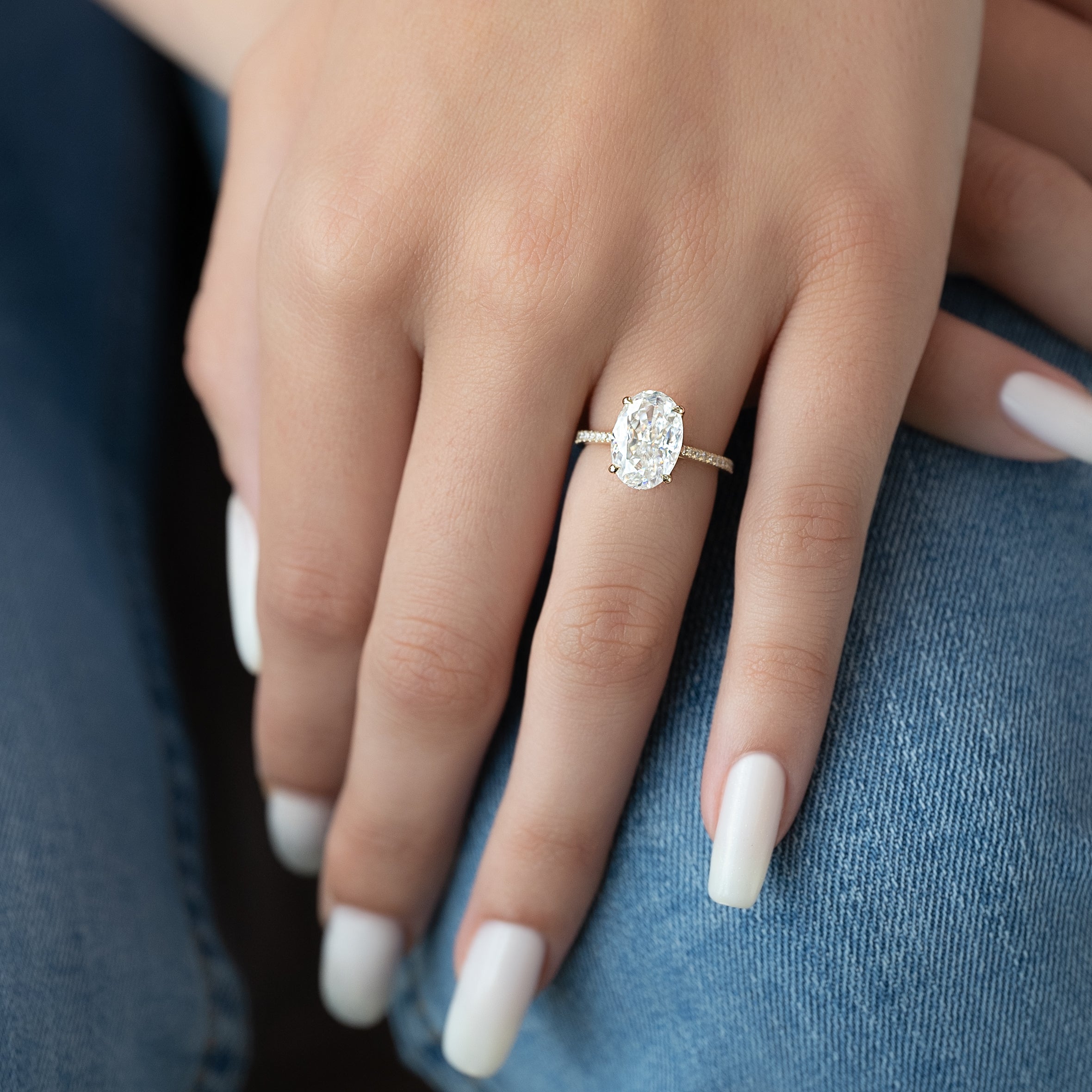 Oval cut CVD diamond engagement ring with pave diamond band in platinum setting