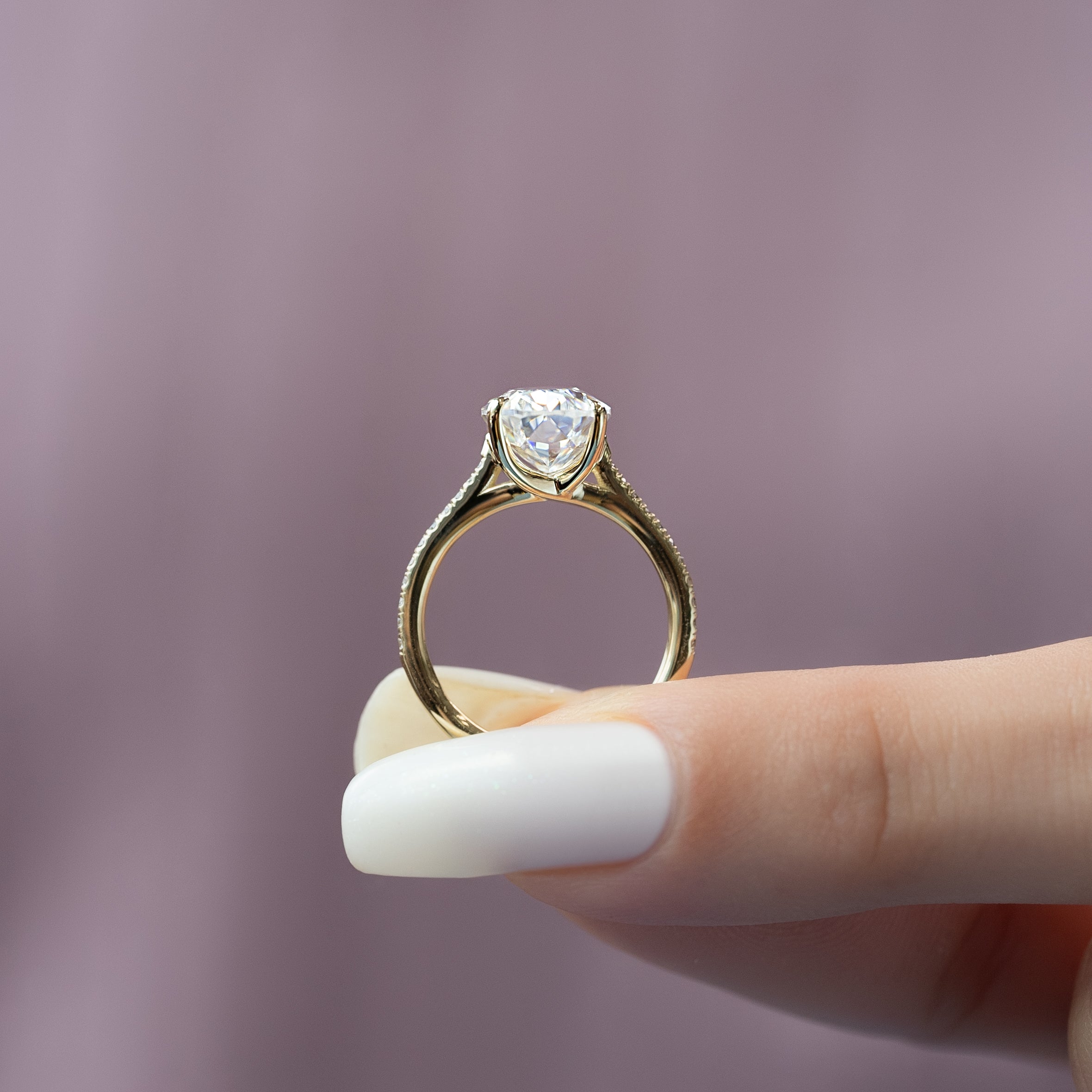 Oval cut CVD diamond engagement ring with pave diamond band in platinum setting