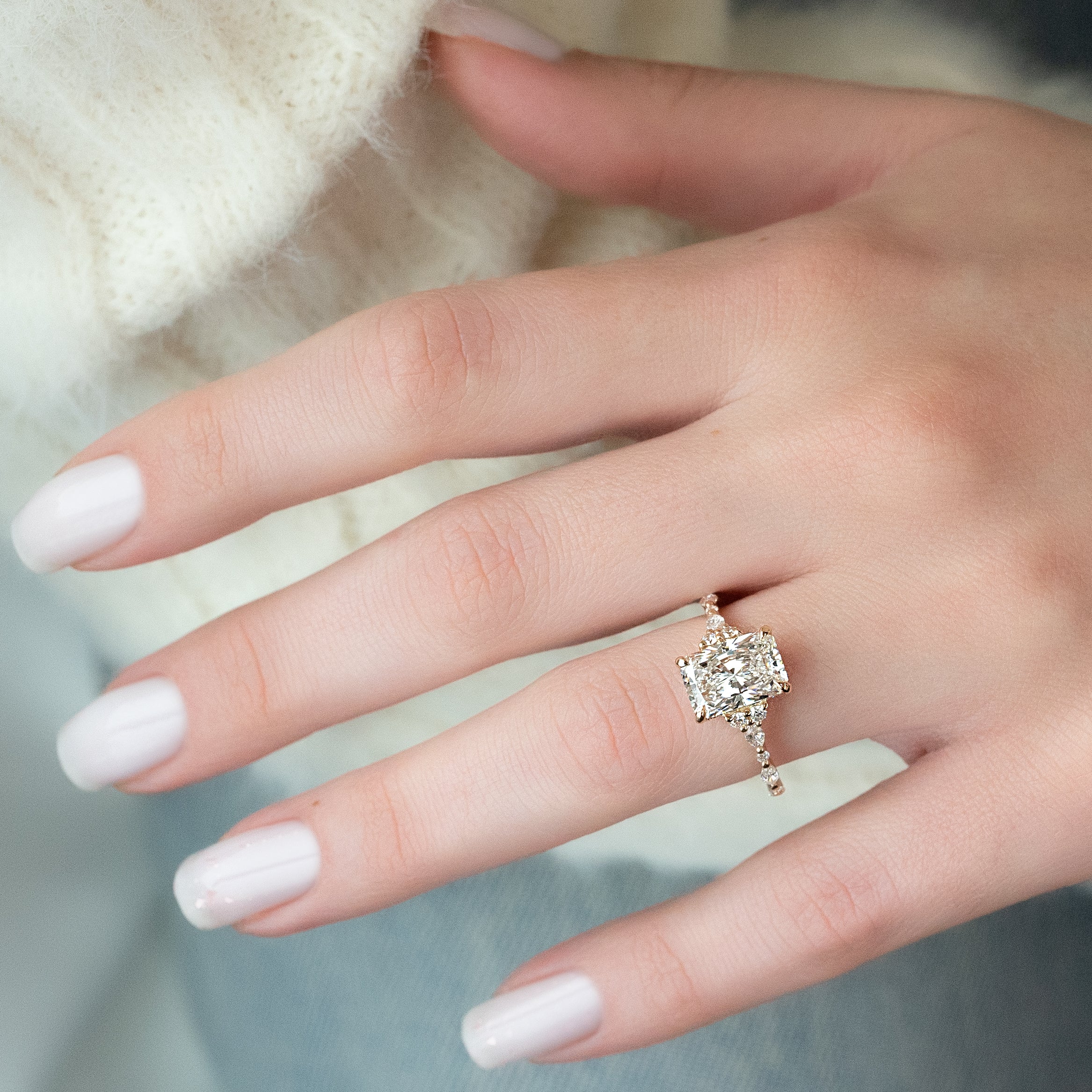 Radiant cut CVD diamond cluster engagement ring with timeless sparkle