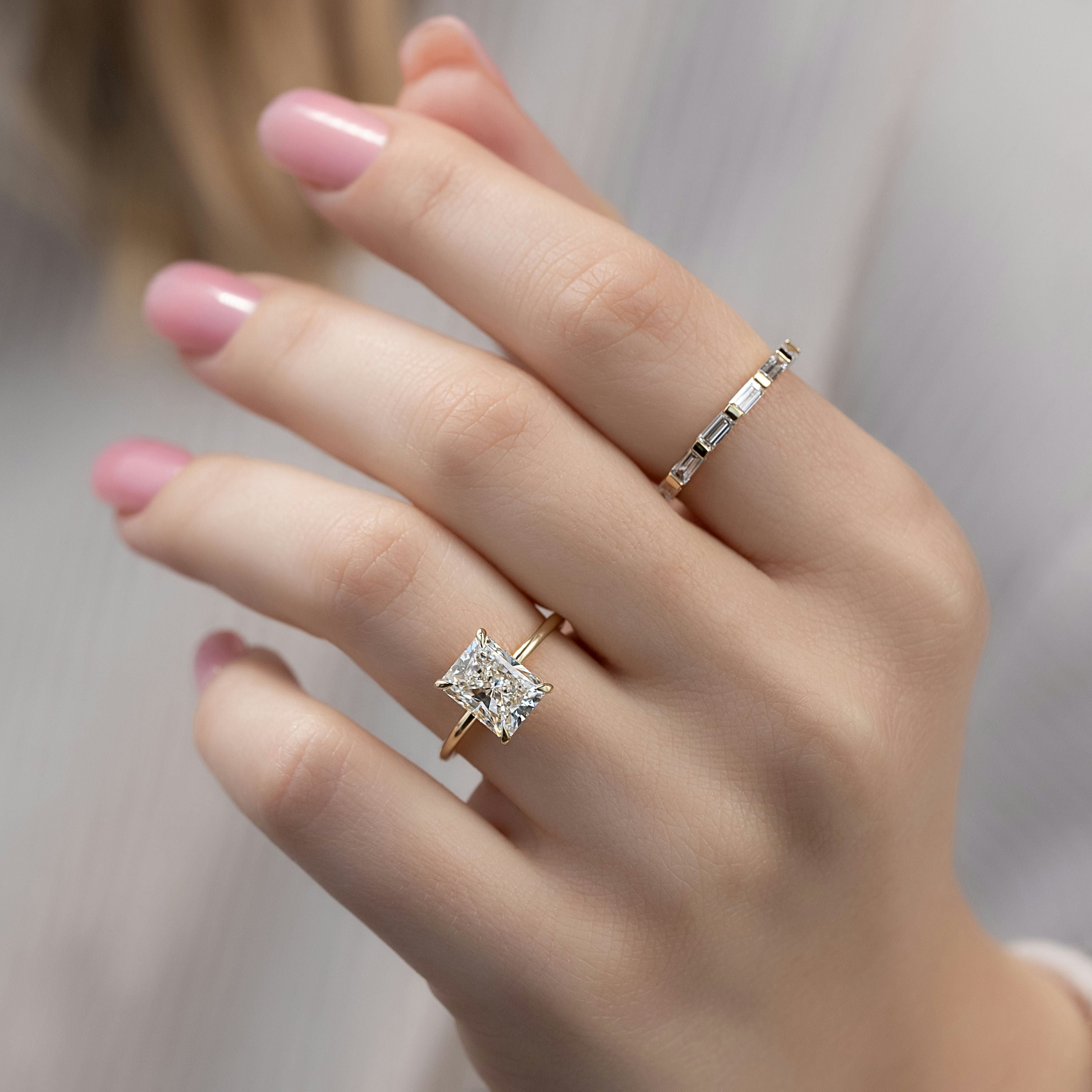 Radiant cut moissanite hidden halo engagement ring in white gold setting