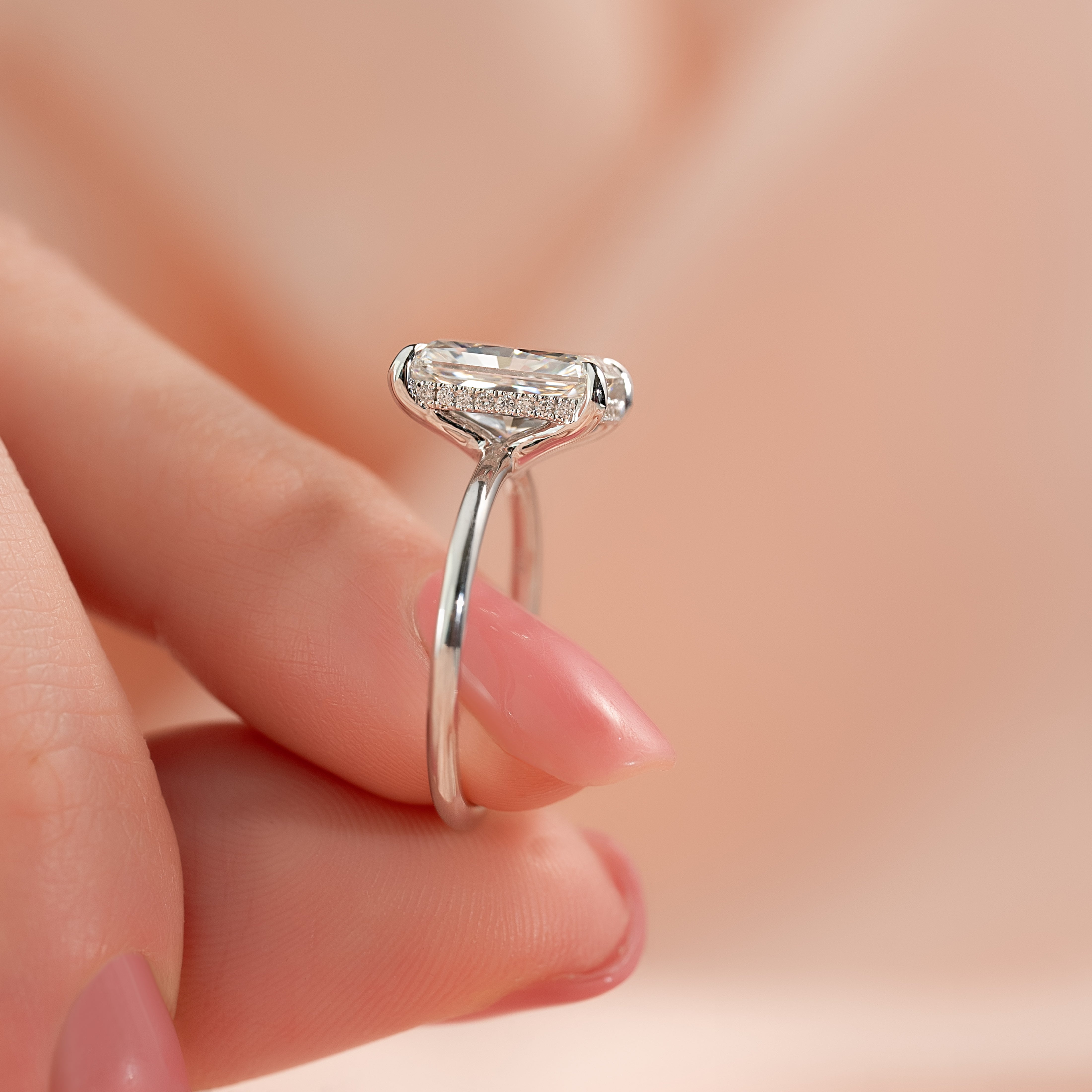 Radiant cut moissanite hidden halo engagement ring in white gold setting