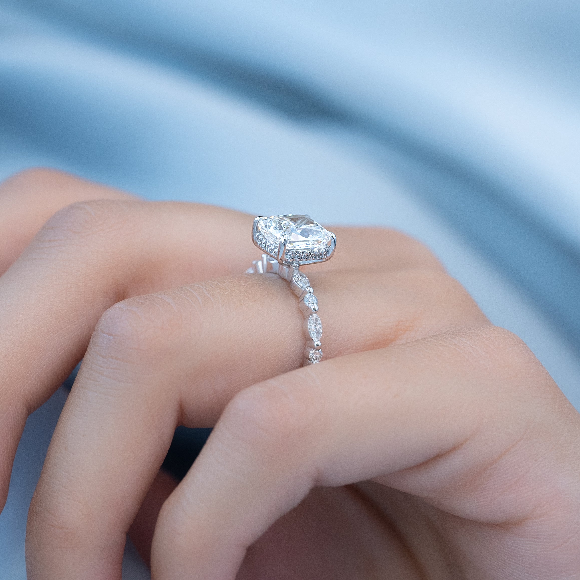 Elongated cushion cut CVD diamond hidden halo engagement ring with pave band in white gold